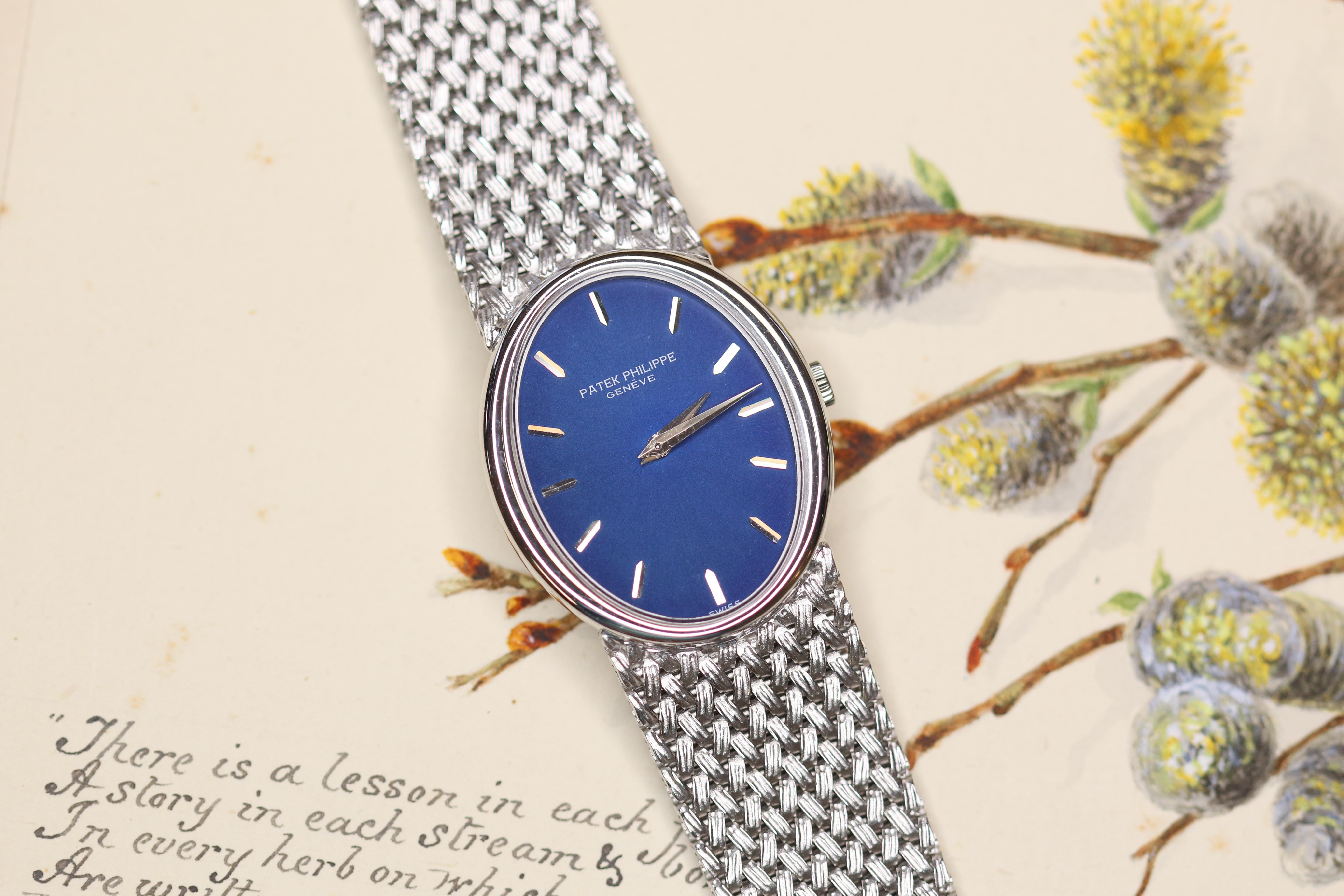 A supreme example of why Patek Philippe stands out from the rest. This unbeatable 18 karat white gold wristwatch with a striking blue dial. This comes with its own certification.

The first thing that draws your eyes into this remarkable watch is