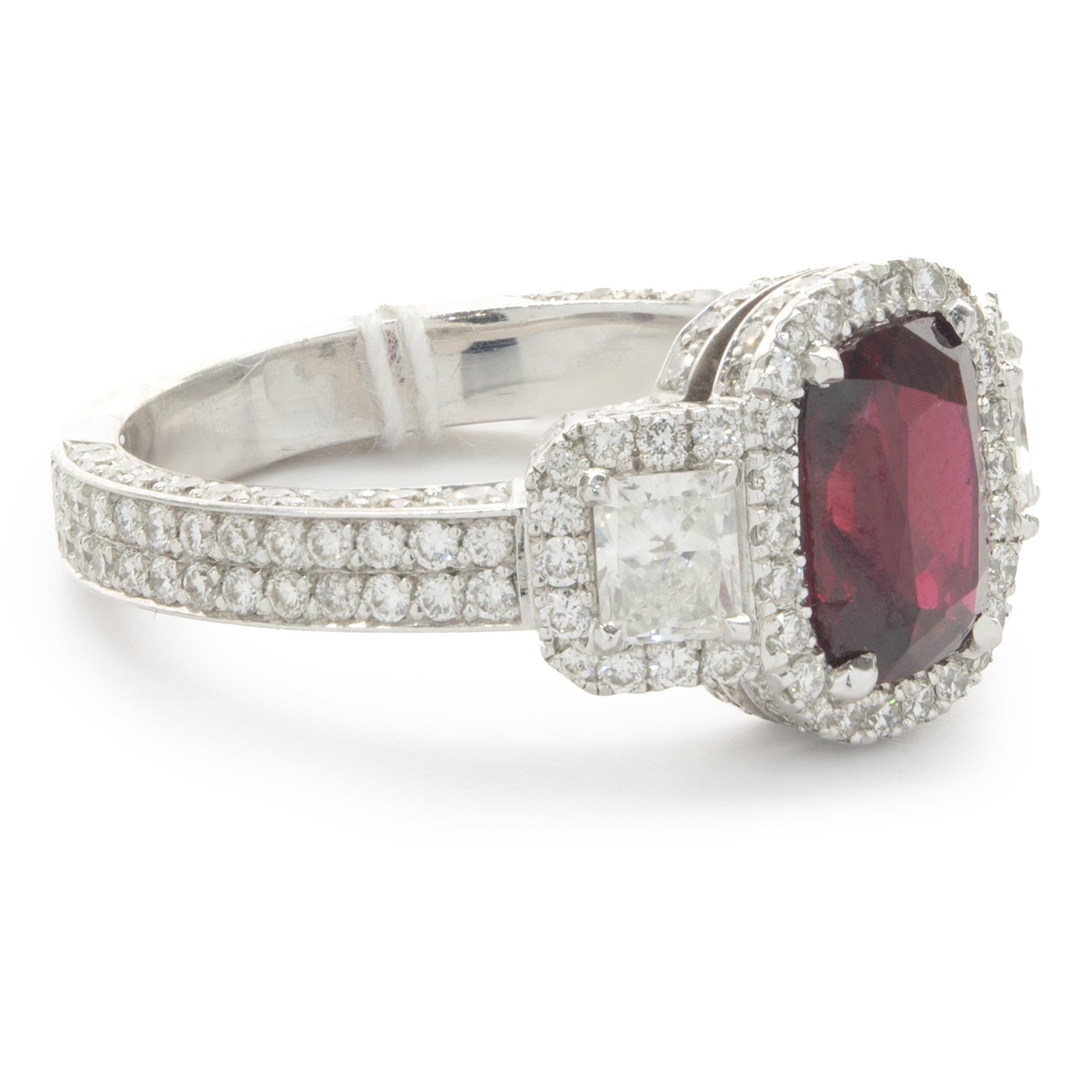 Designer: custom
Material: 18K white gold
Diamond: round brilliant & princess cut = 1.60cttw
Color: G / H
Clarity: VS2-SI1
Ruby: 1 oval cut = 2.01ct
Color: Pigeons Blood
Clarity: AA
Dimensions: ring top measures 10.85mm wide
Ring Size: 6.5