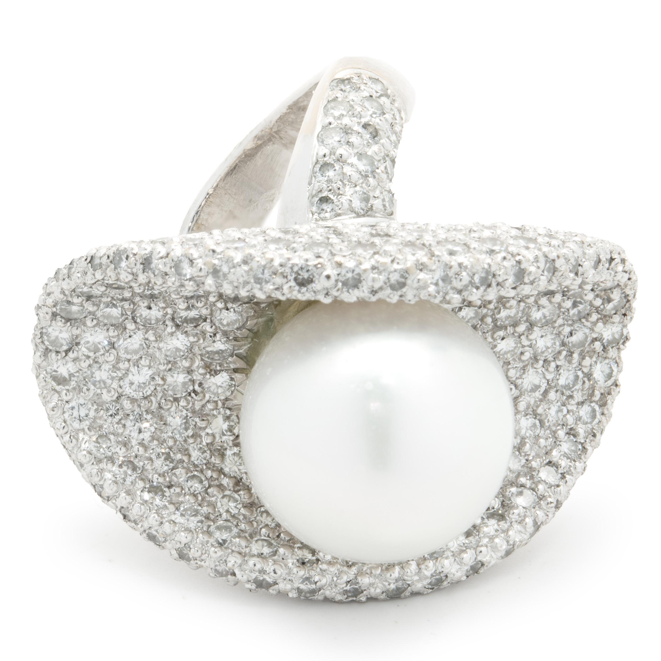 Designer: custom design
Material: 18K white gold 
Earrings:
Diamond: 400 round brilliant cut = 16.00cttw
Color: G
Clarity: VS1-2
Ring:
Diamond: 274 round brilliant cut = 5.48cttw
Color: G
Clarity: VS1-2
Dimensions: earrings measure 28x21mm, ring top