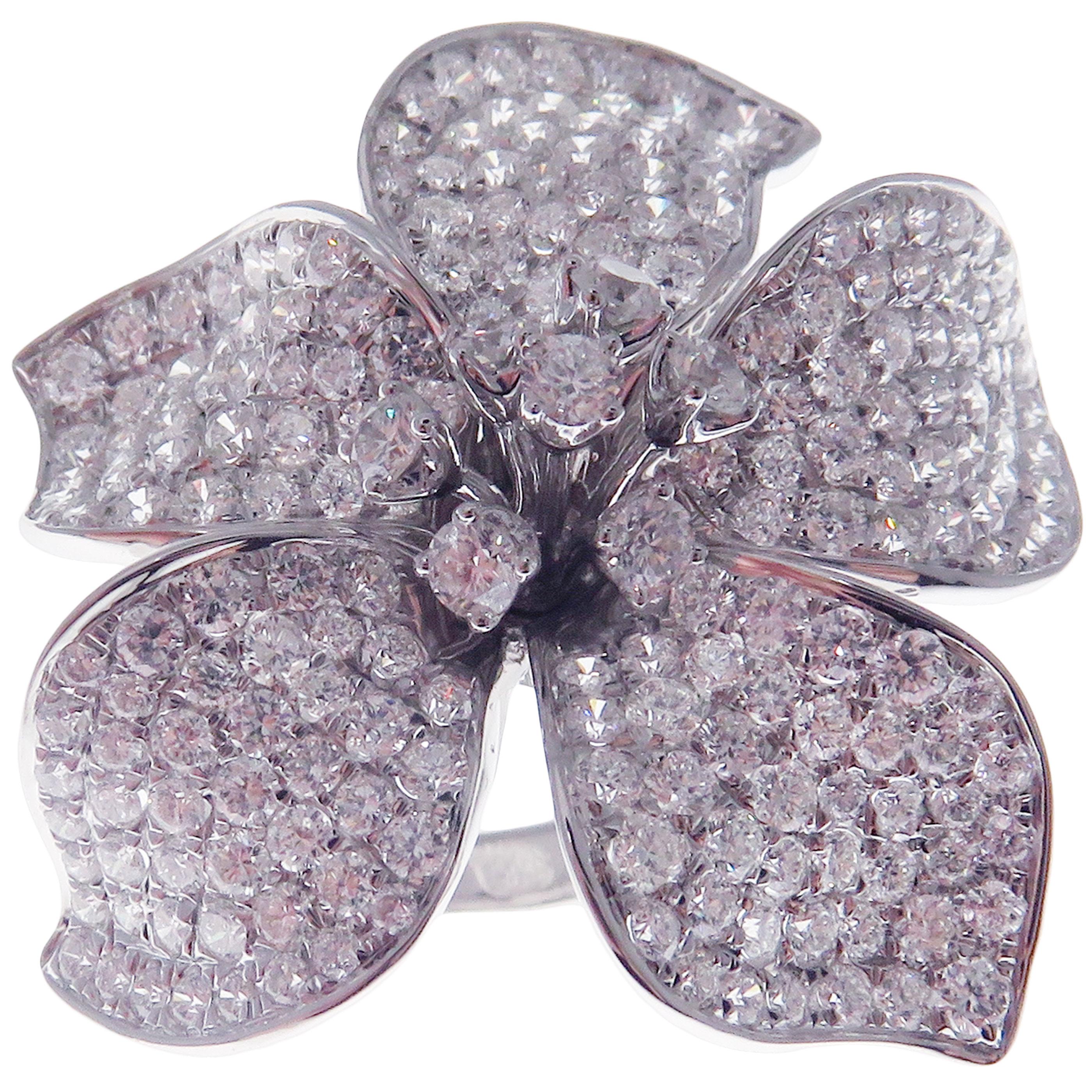 This pave diamond large flower ring is crafted in 18-karat white gold, featuring 218 round white diamonds totaling of 4.75 carats.
Approximate total weight 14.45 grams.
Standard Ring size 7
SI-G Quality natural white diamonds.