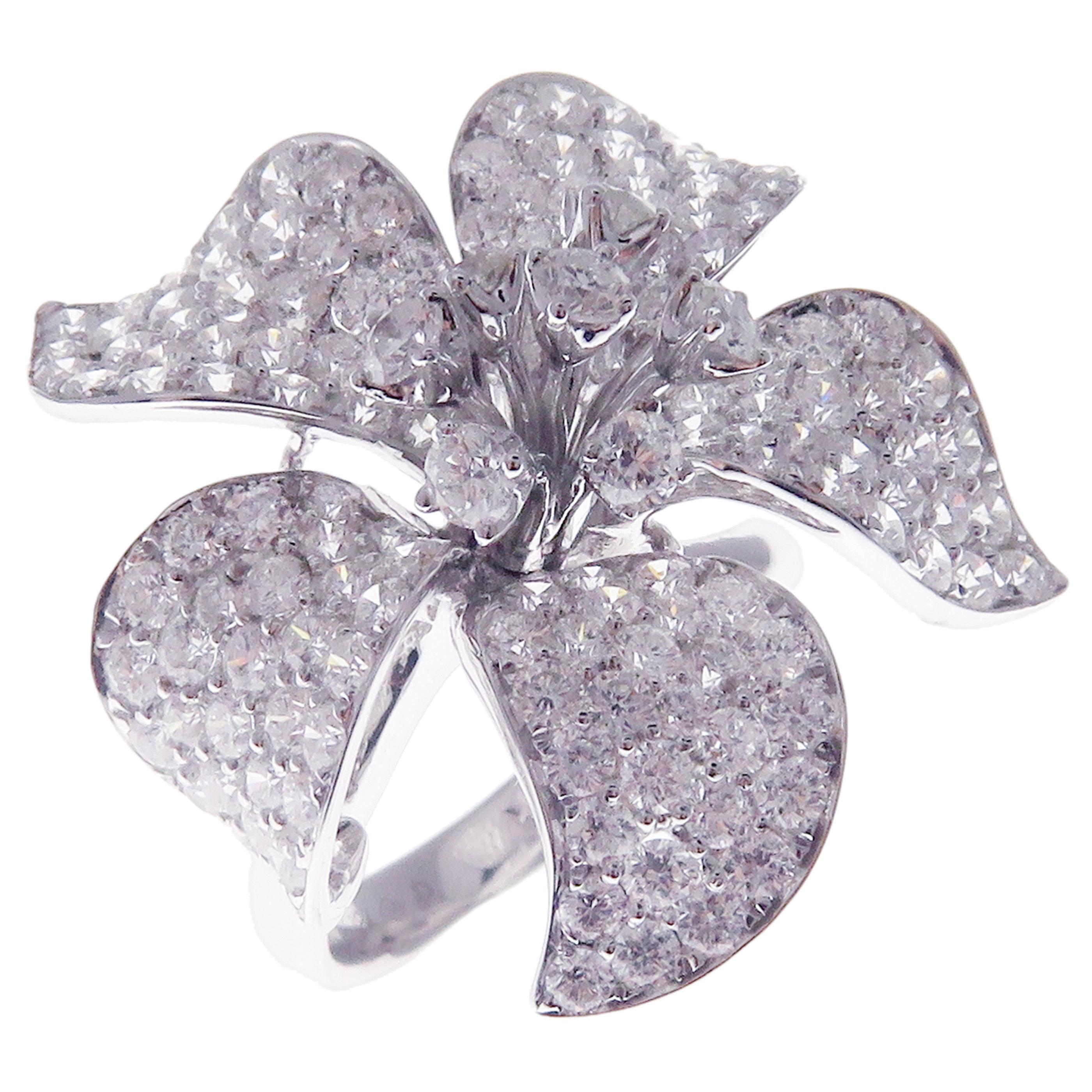 This pave diamond medium flower ring is crafted in 18-karat white gold, featuring 157 round white diamonds totaling of 4.58 carats.
Approximate total weight 10.14 grams.
Standard Ring size 7
SI-G Quality natural white diamonds.