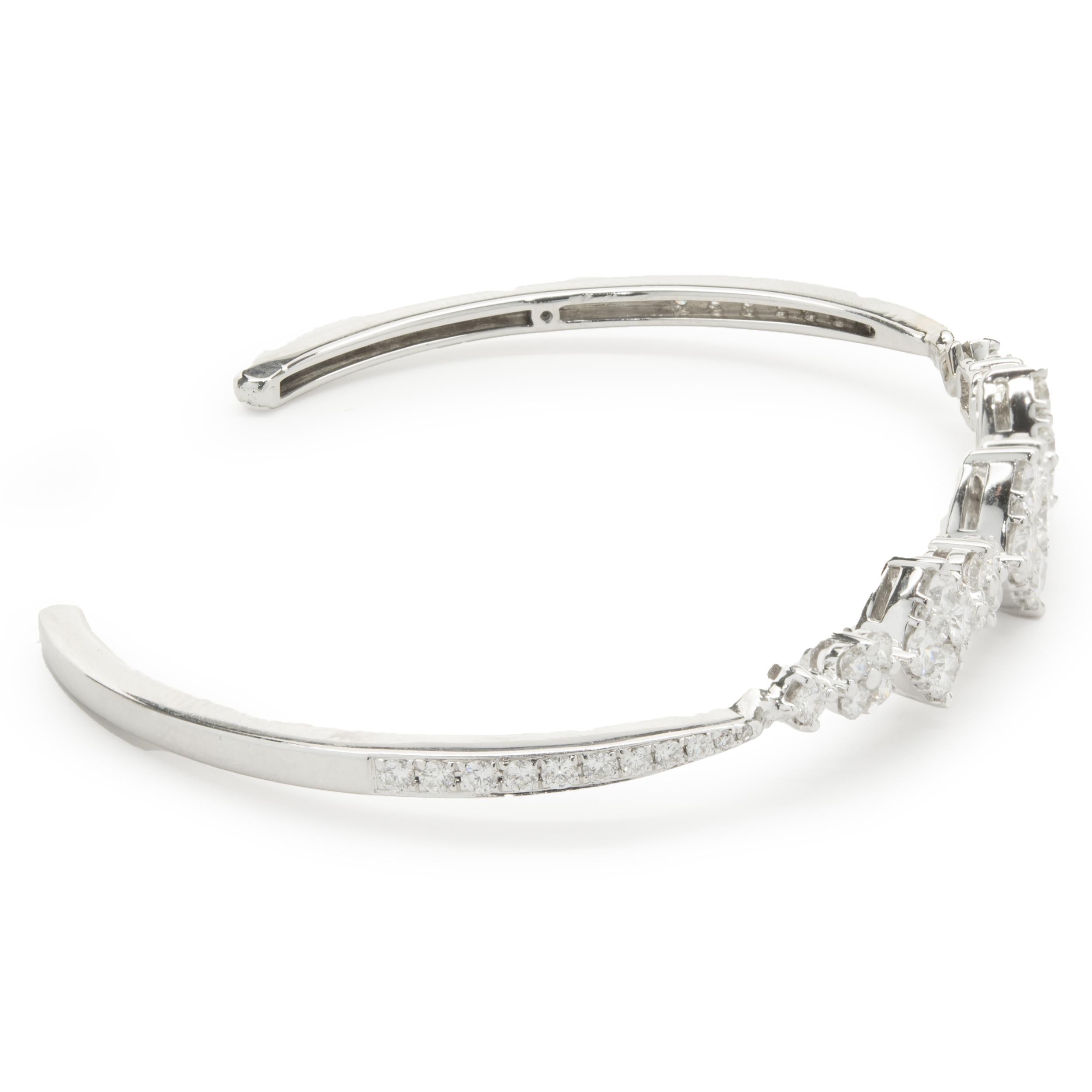 Designer: custom 
Material: 18K white gold
Diamond: 67 round brilliant cut = 2.51cttw
Color:  F / G
Clarity: VS2
Dimensions: bracelet will fit up to a 6-inch wrist
Weight: 10.24 grams
