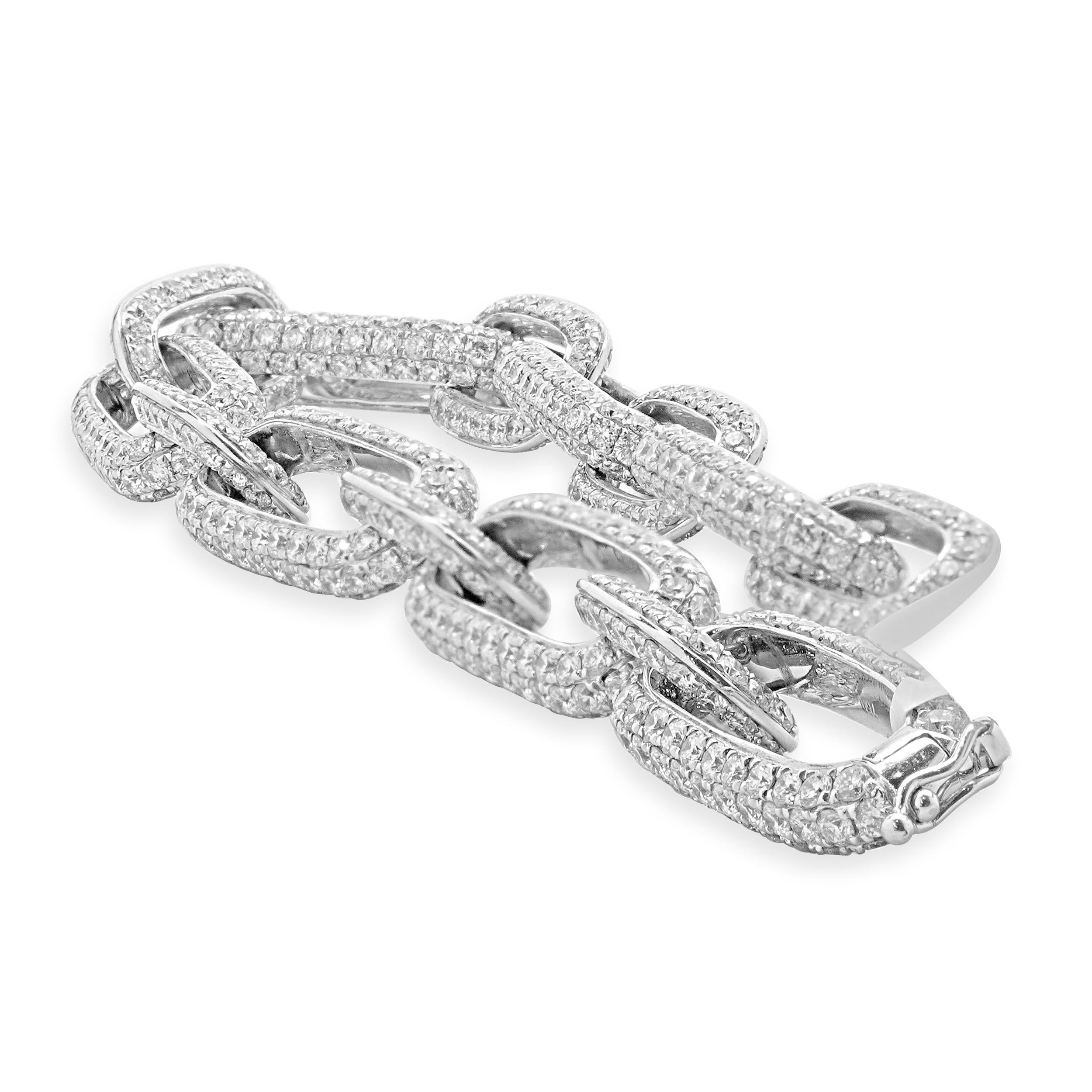 Designer: custom
Material: 18K White gold
Diamond: 897 round brilliant cut = 17.60cttw
Color: H
Clarity: SI1-2
Dimensions: bracelet will fit up to a 8-inch wrist
Weight: 27.11 grams