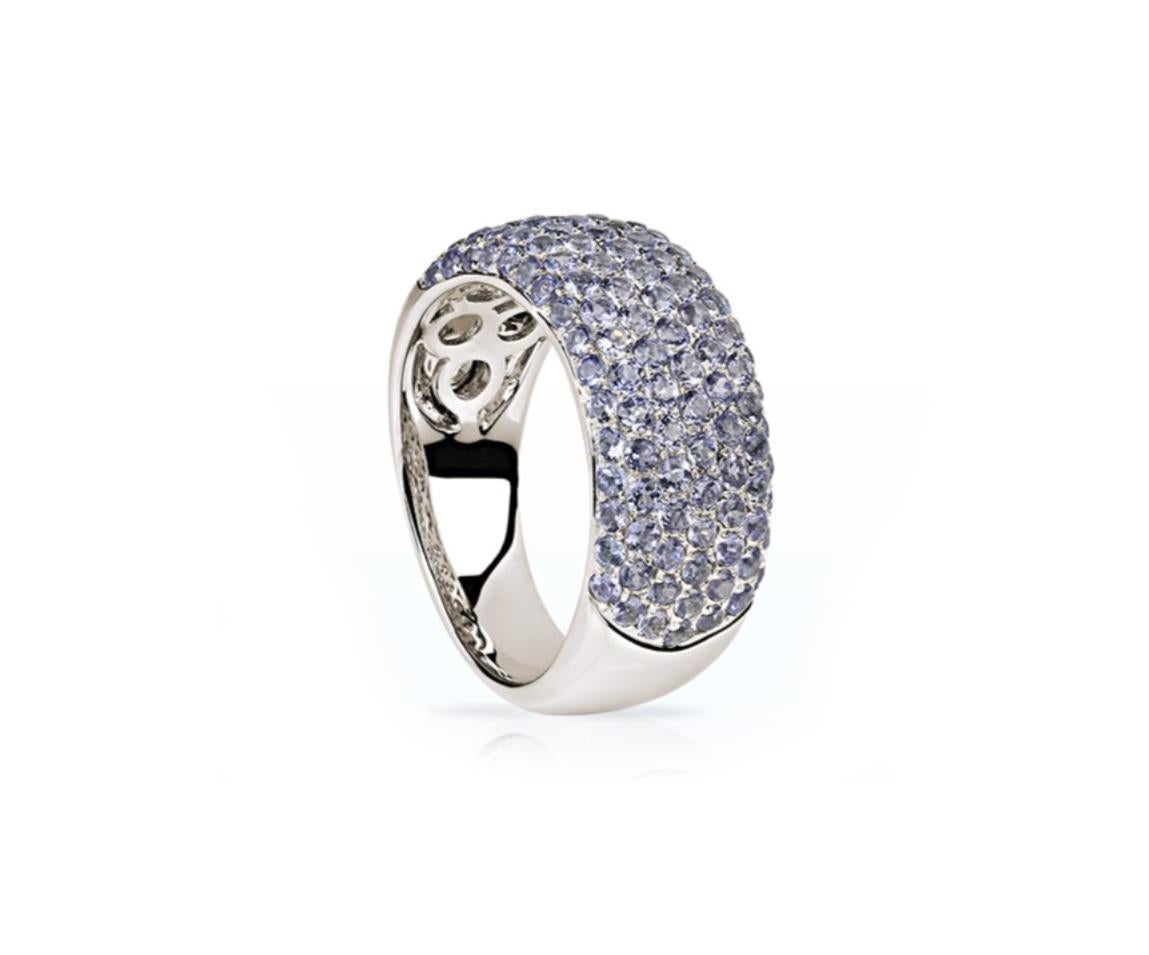 This pave diamonds ring is made of 18 karat white gold with 121 natural tanzanites, 2,45 carats in total.
We work with german gems company, that is in the market since 19th century. 
