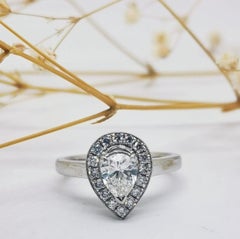 18 Karat White Gold Pear Cut Vintage White Diamond Engagement Ring