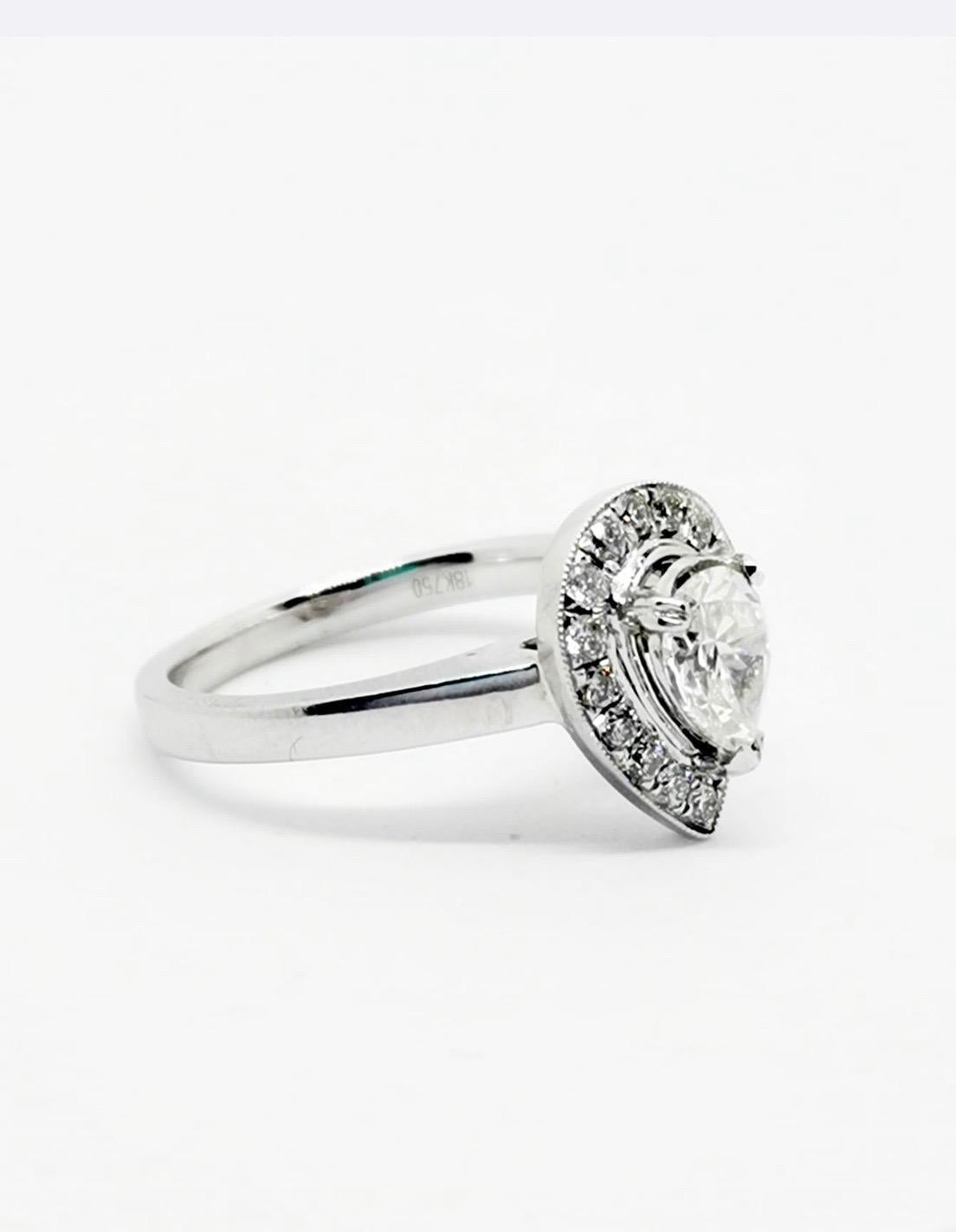 Women's or Men's 18 Karat White Gold Pear Cut Vintage White Diamond Engagement Ring For Sale