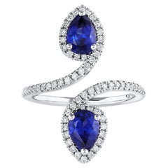 18 Karat White Gold Pear-Shaped Blue Sapphire Diamond Bypass Ring
