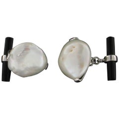 Antique 18 Karat White Gold Pearl and Onyx Cufflinks