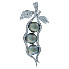 18 Karat White Gold Pendant-Brooch with Diamonds and Dark Tahitian Pearls