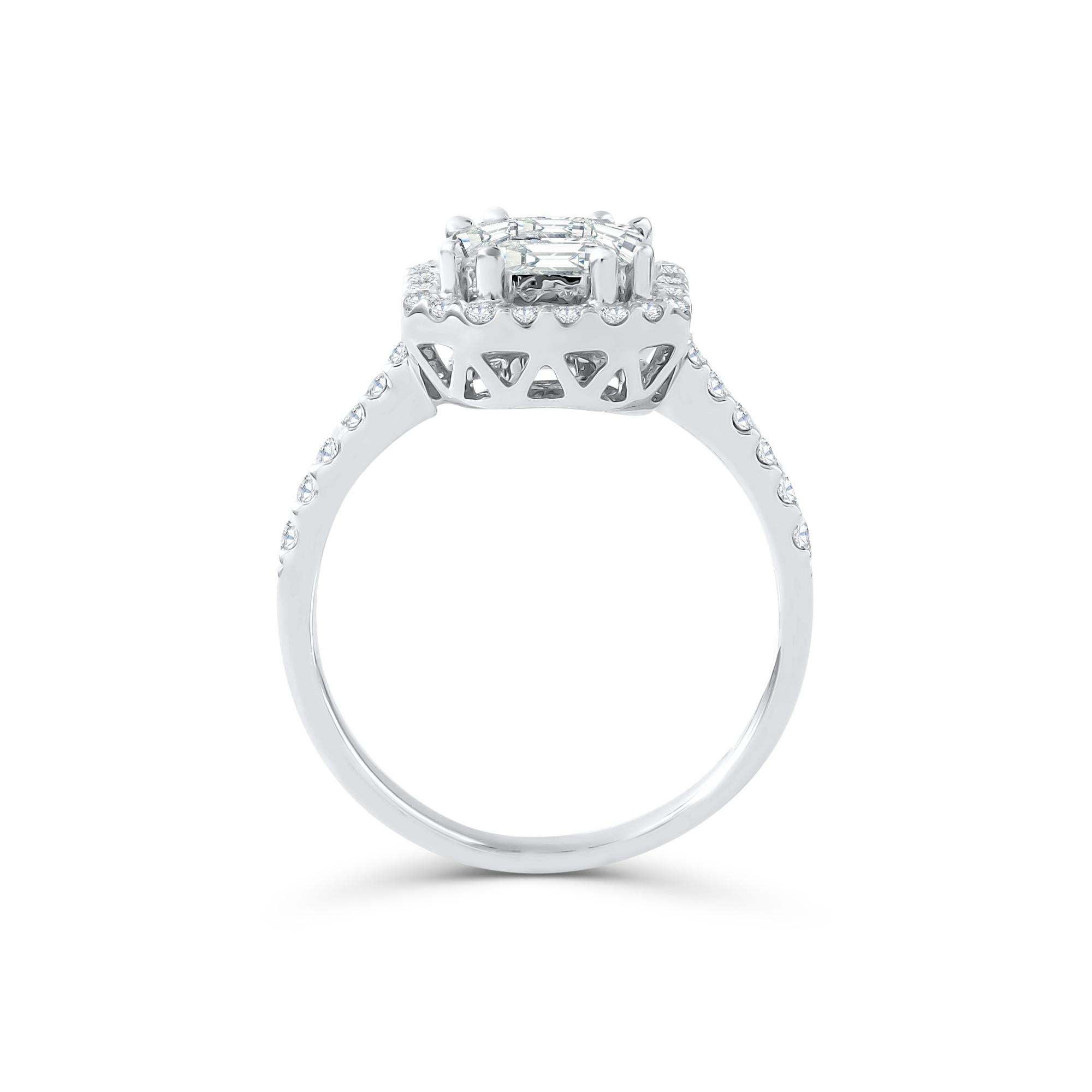 This diamond ring has a Emerald shape Illusion (Pie Cut) to create the look of a 2.75 carat single Emerald cut stone surrounded beautifully with brilliant round diamonds, Handcrafted in 18 kt white gold. This Ring will add a touch of sophistication