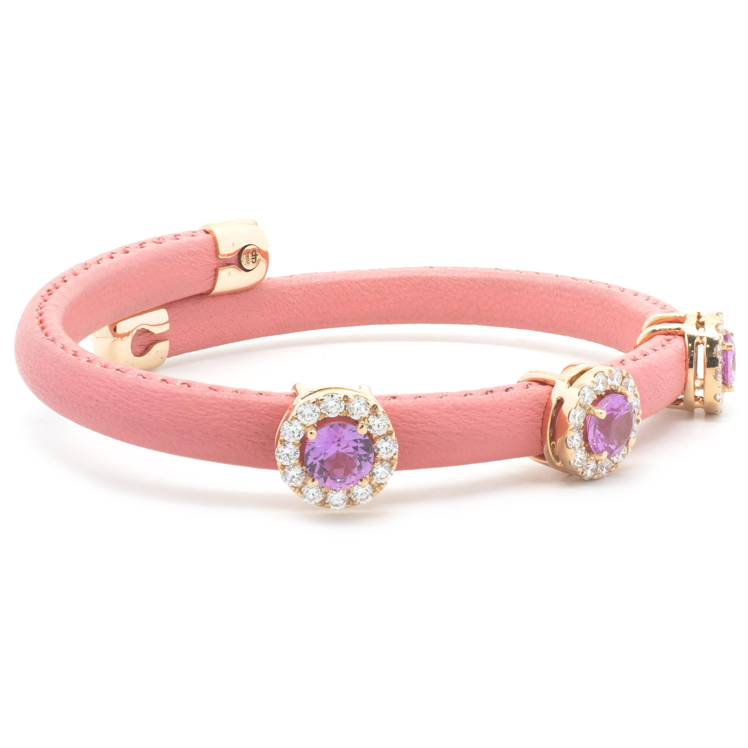 Designer: custom
Material: 18K white gold
Diamond: 36 round cut = .81cttw
Color: G/H
Clarity: VS
Pink Sapphire: 3 round cut = 1.93cttw
Dimensions: bracelet will fit up to a 7-inch wrist
Weight: 11.41 grams
