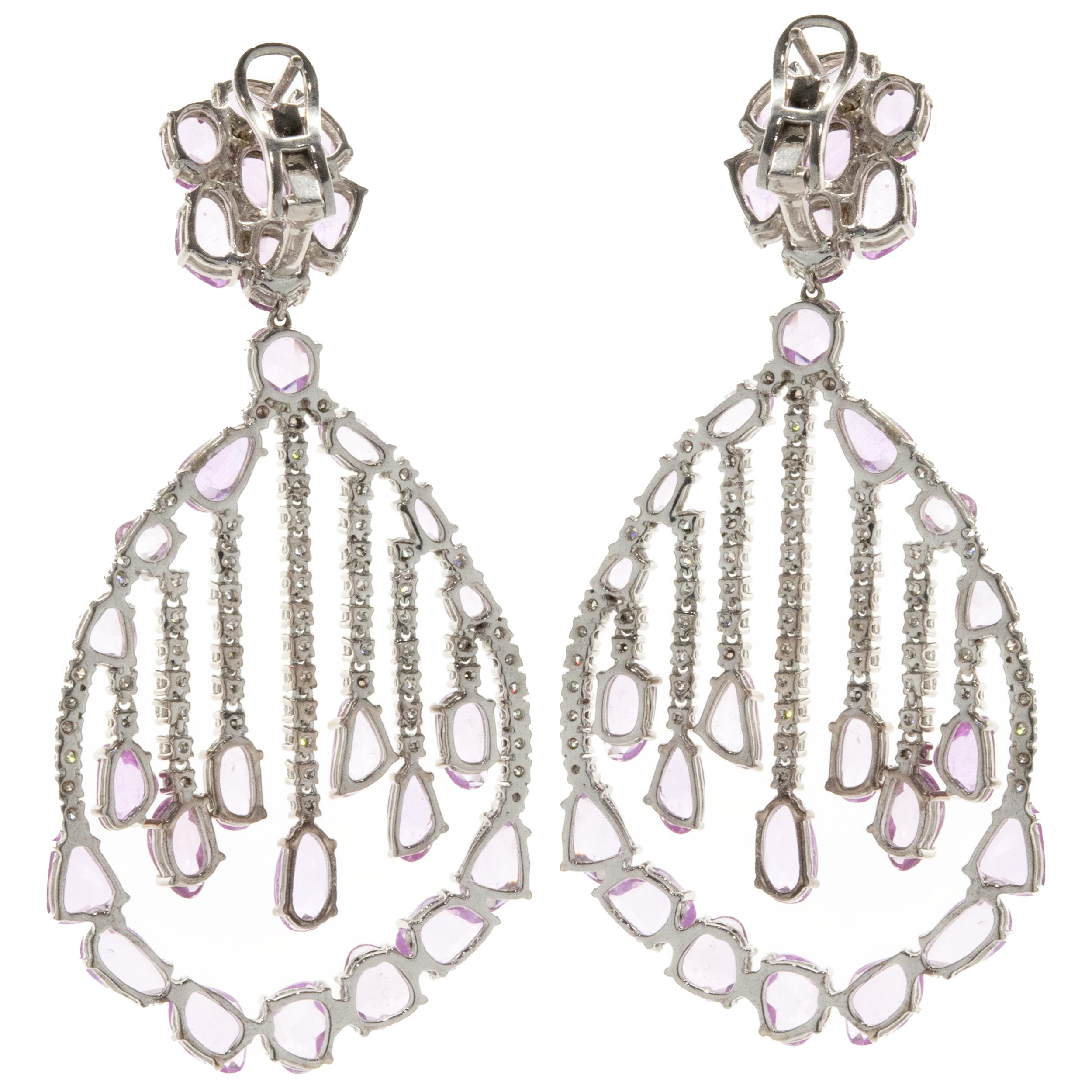 Designer: custom
Material: 18K white gold
Diamonds: 134 round brilliant cut = 2.90cttw
Color: G
Clarity: SI1
Pink Sapphires: 56 multi cut = 21.98cttw
Dimensions: earrings measure 2.5-inches in length
Fastenings: posts with omega backs
Weight: 26.12