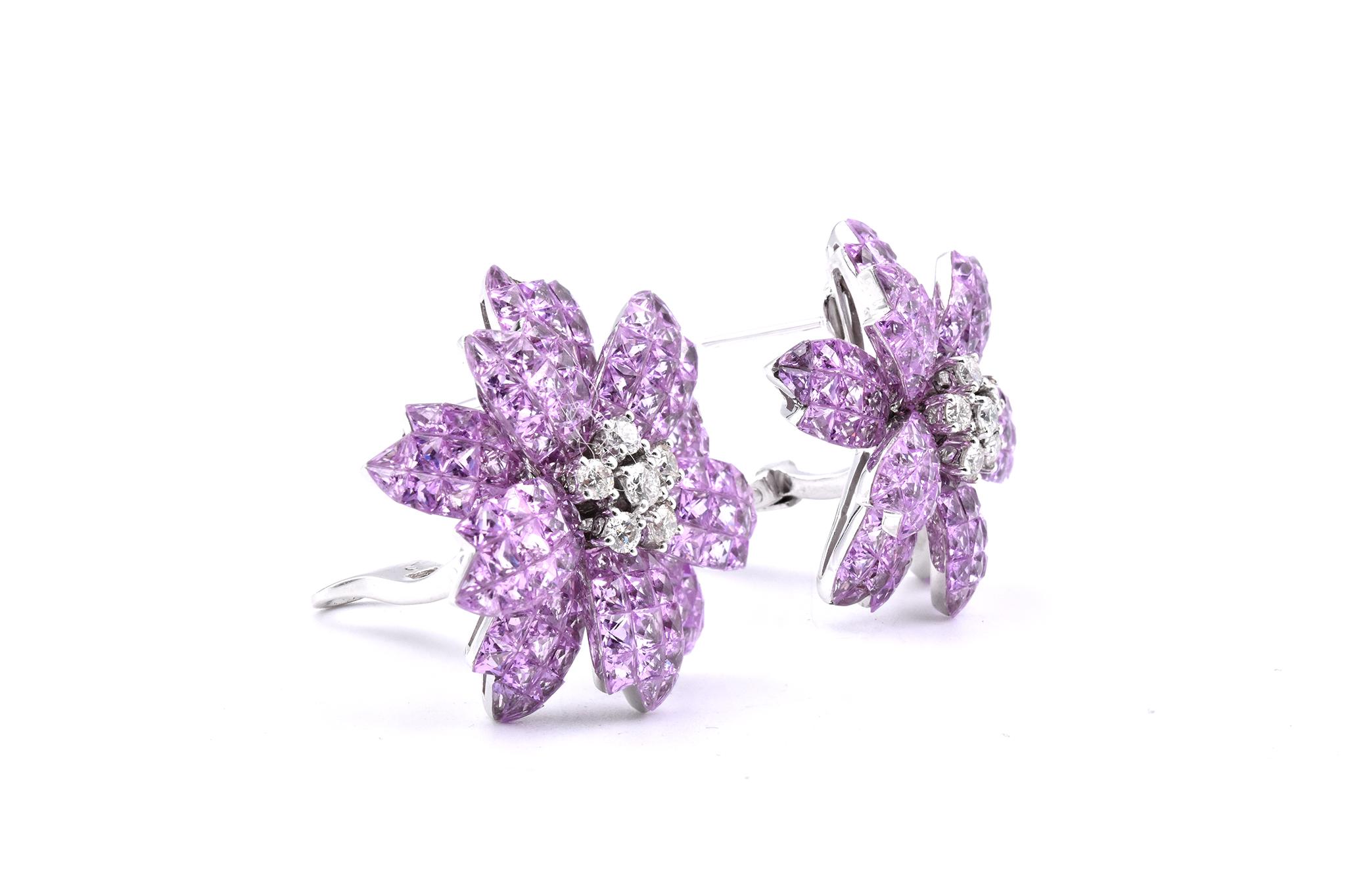 Material: 18k white gold
Sapphire: 26.00cttw
Color: Natural Pink
Diamonds: 12 round cut = .44cttw 
Color: G
Clarity: VS
Dimensions: earrings measure 27mm in diameter
Fastenings: post with omega backs
Weight: 23.68 grams