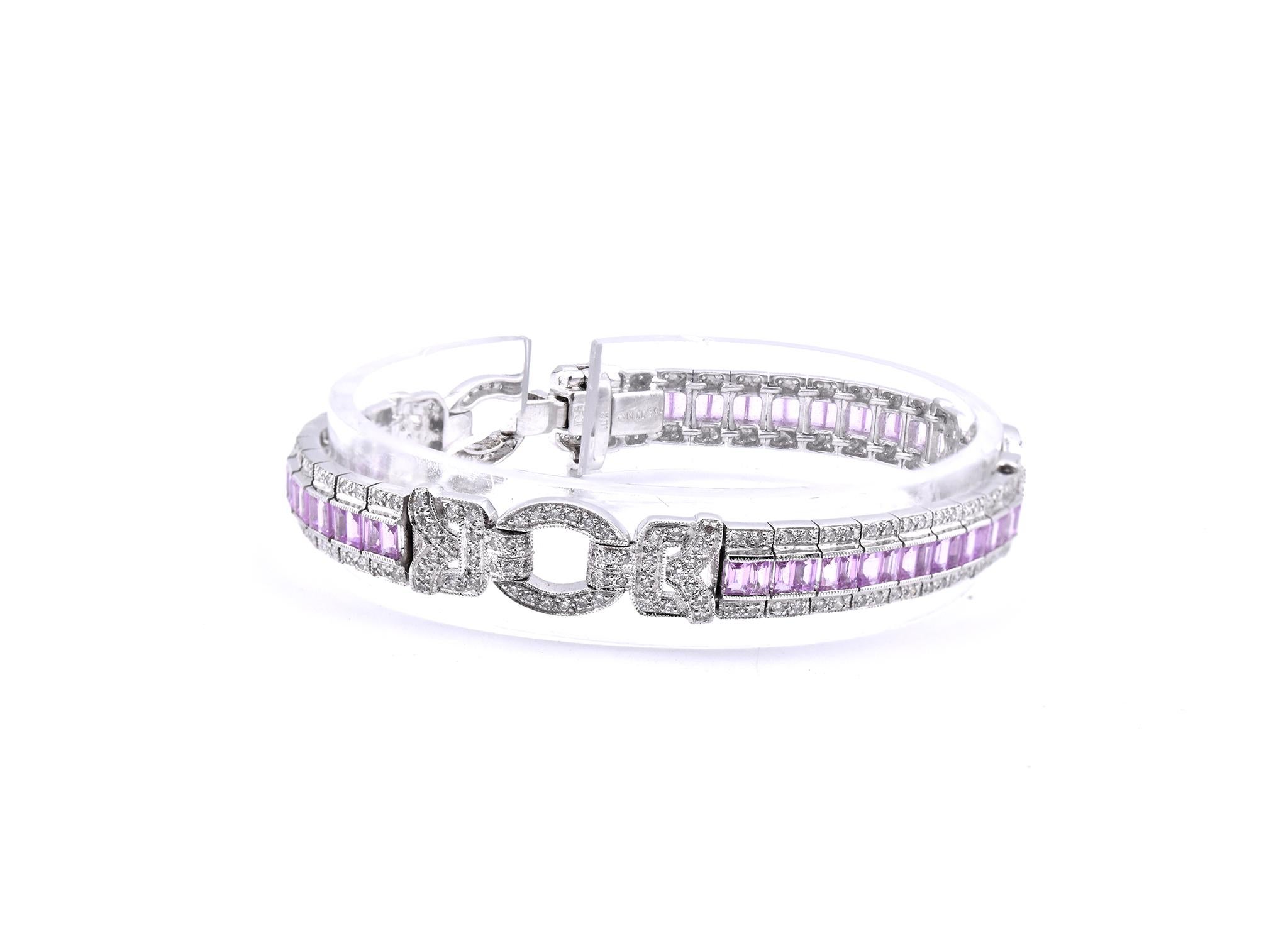 Material: 18K white gold
Diamond: 256 round cut = 1.66ct
Color: H
Clarity: SI1
Sapphire: 54 baguette cut = 4.50cttw
Color: Pink
Dimensions: bracelet will fit a 7-inch wrist, measures 7.75mm in width
Weight: 26.08 grams