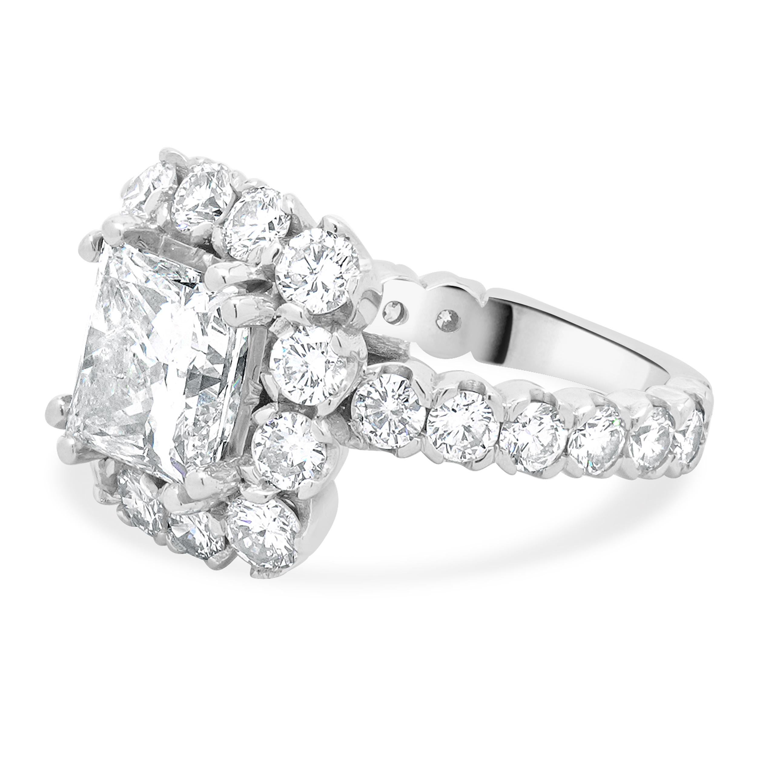 Material: 18K white gold
Center Diamond: 1 princess cut = 3.03ct
Color: G
Clarity: SI2
EGL: US 91449225D
Diamond: 26 round brilliant cut = 3.11cttw
Color: G / H
Clarity: VS2-SI1
Ring Size: 4.75 (please allow up to 2 additional business days for