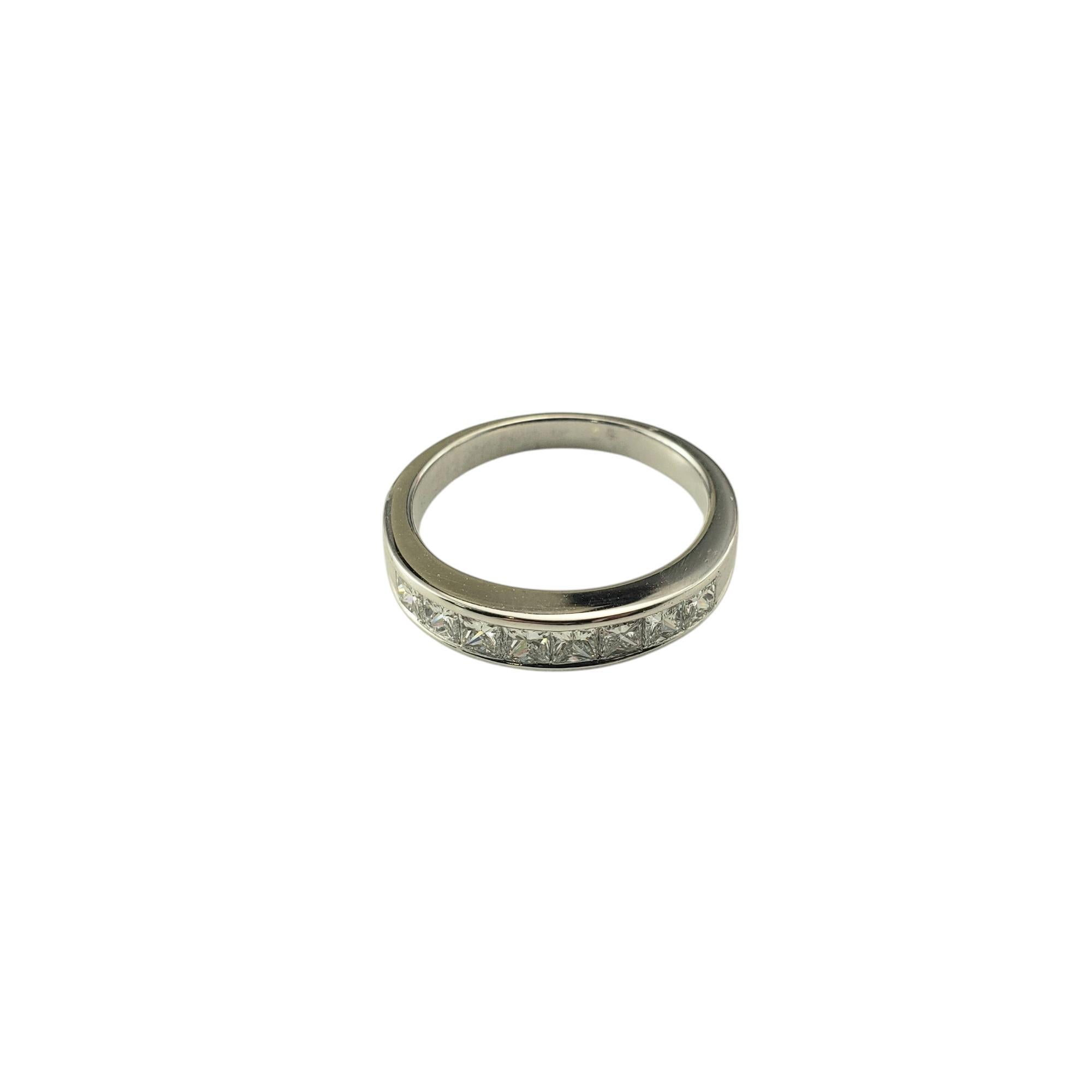 18 karat White Gold Princess Cut Diamond Wedding Band Ring Size 5.25

This 14K white gold wedding band is a stunning symbol of everlasting love, featuring eight princess cut diamonds for a perfect balance of brilliance and sophistication. The sleek