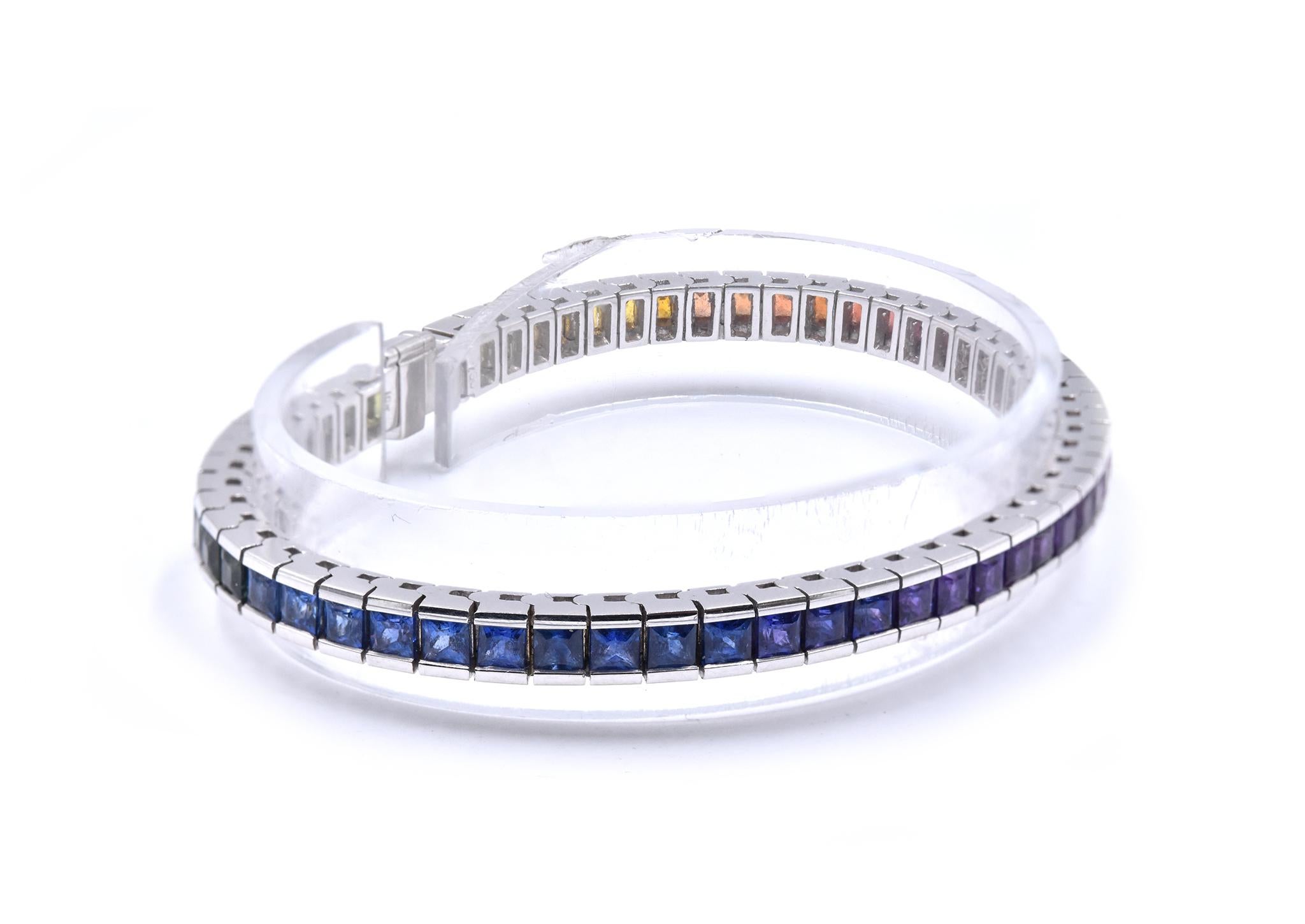 Material: 18K white gold
Sapphire: 59 princess cut = 10.03cttw
Color: Rainbow
Dimensions: bracelet will fit a 7.5-inch wrist
Weight: 26.3 grams
