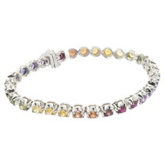 Bracciale tennis con zaffiri arcobaleno in oro bianco 18 carati