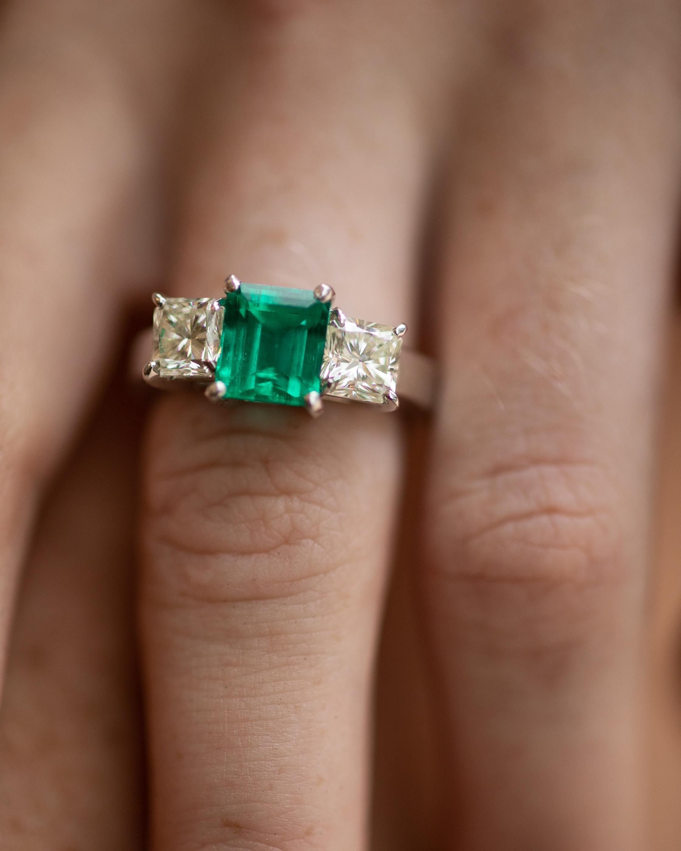 This 18K white gold stunning ring is from our Timeless Collection. It is made of a beautiful rectangular shape emerald 2.45 Carat decorated by 2 princess cut natural light yellow diamonds in total of 1.02 Carat each. Total metal weight is 8.3 gr. 