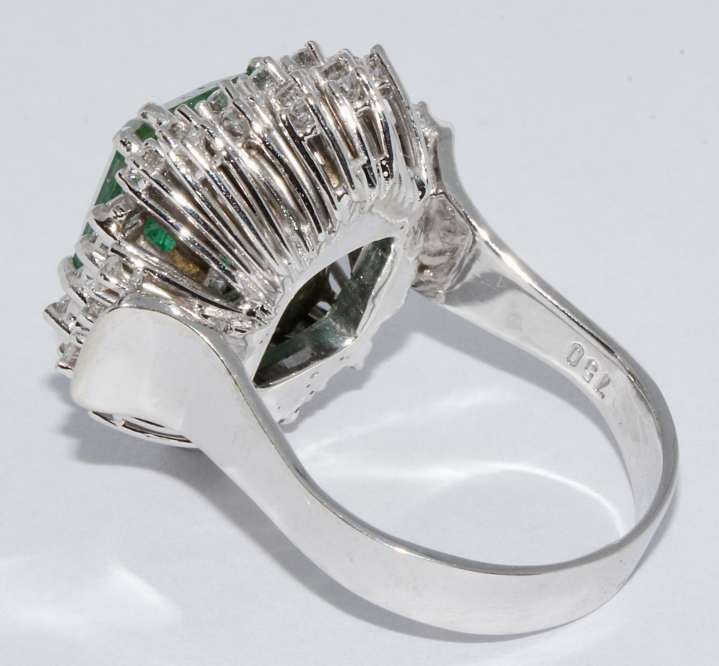 Women's 18 Karat White Gold Ring Set with White Diamonds and Large 4.5 Carat Emerald For Sale