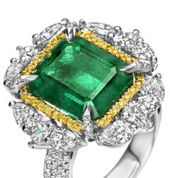 18 Karat White Gold Ring with 12.27 Carat Emerald, Pear Shape Diamonds 2.62 Ct
