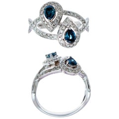 18 Karat White Gold Ring with 2 Natural Enhanced Blue Diamonds