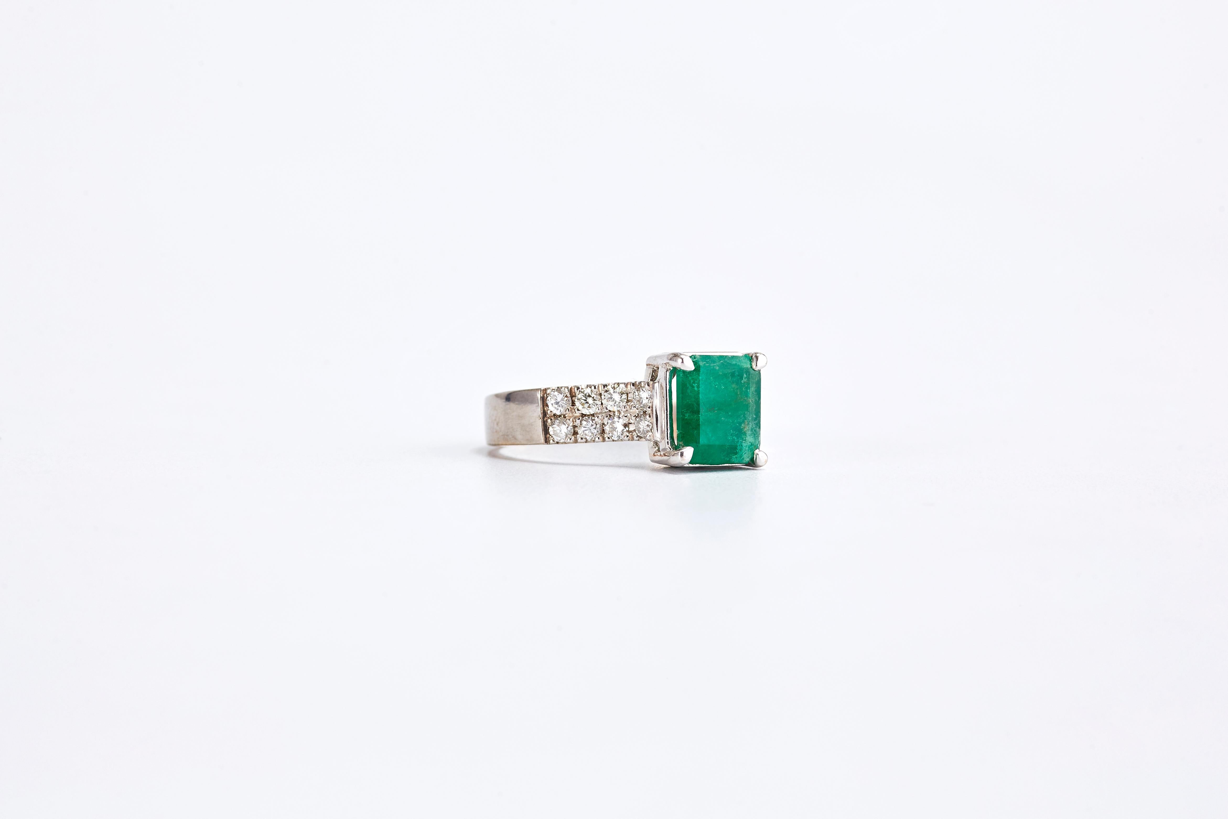 18 Karat White Gold Ring with 2.30 carat Square Cut Emerald and Diamonds
18K white gold ring with center stone square Emerald and 2 rows of gorgeous round diamonds.
The ring is set with quality diamonds G VS1 total of 0.90 ct. 
Emerald stone weight