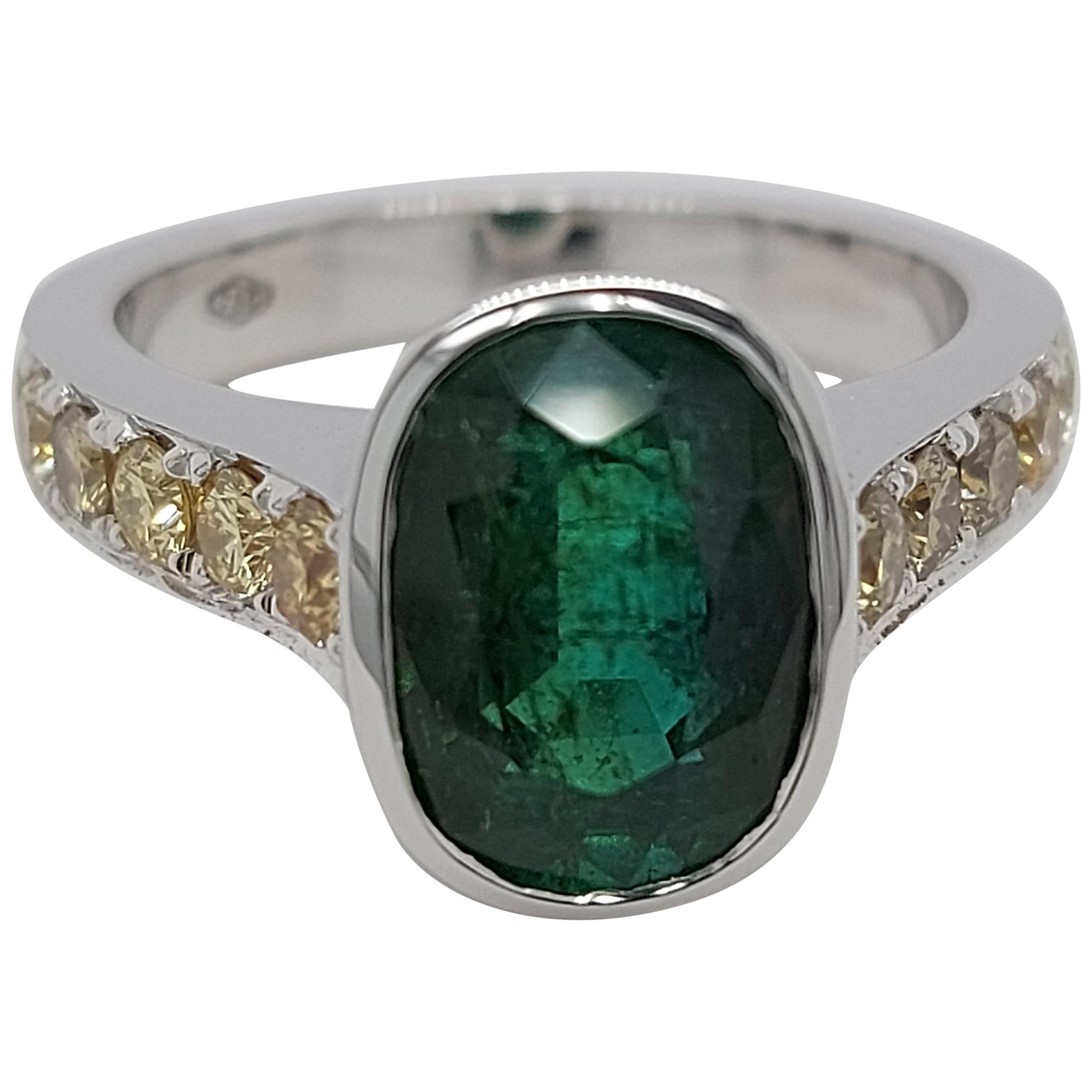 18 Karat White Gold Ring with 3.15 Carat Emerald and Fancy Yellow Diamonds For Sale