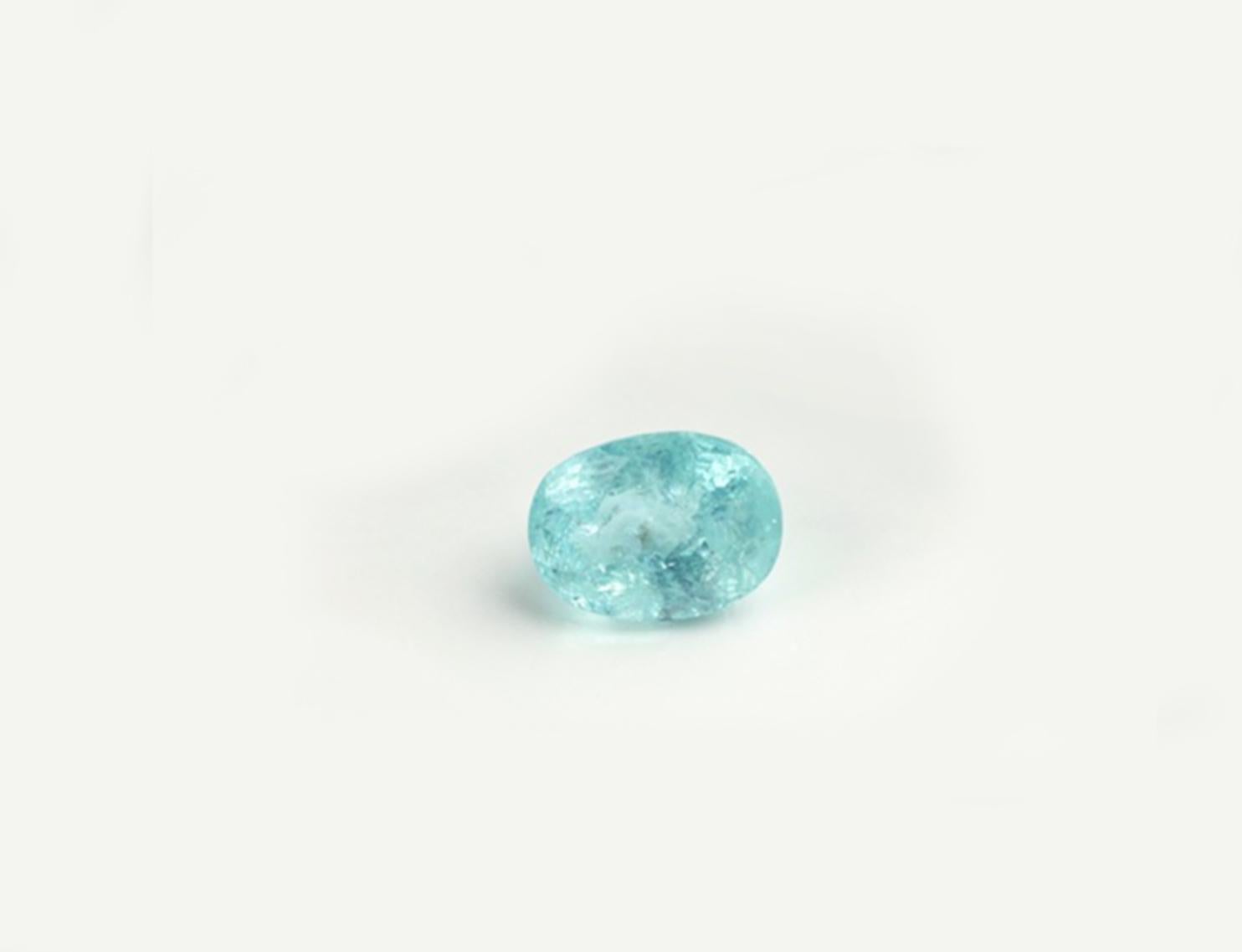 This ring is in 18 karat white gold with huge 3,7 carats neon copper bearing Paraiba tourmaline (10,8x8mm), oval cut, very blue. The gem is already pretty big, therefore it catches eye's attention by fine jewellery accurate work of tiny prongs, and