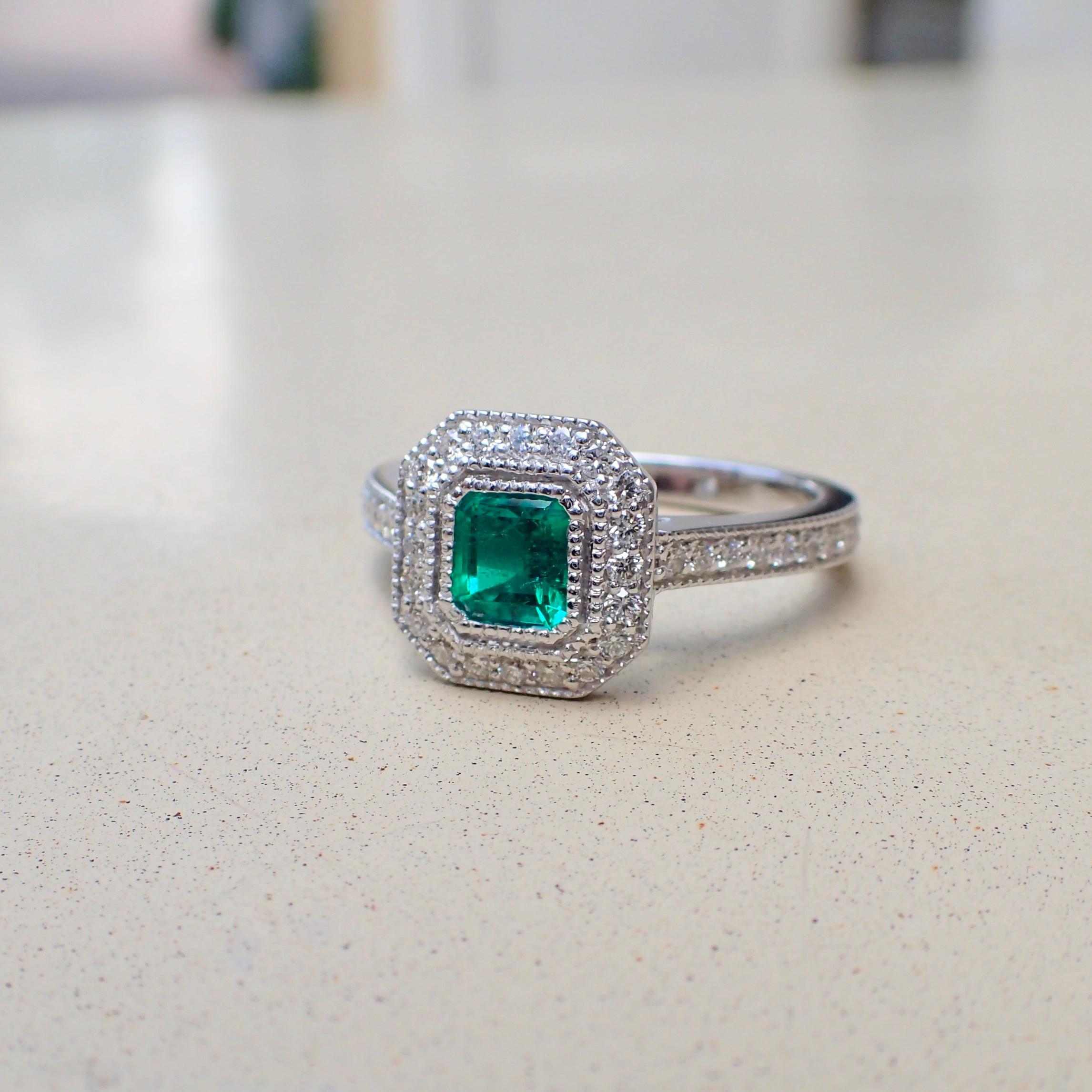 Contemporary 18 Karat White Gold Ring with a 0.518 Carat Emerald and 0.37 Carat of Diamond