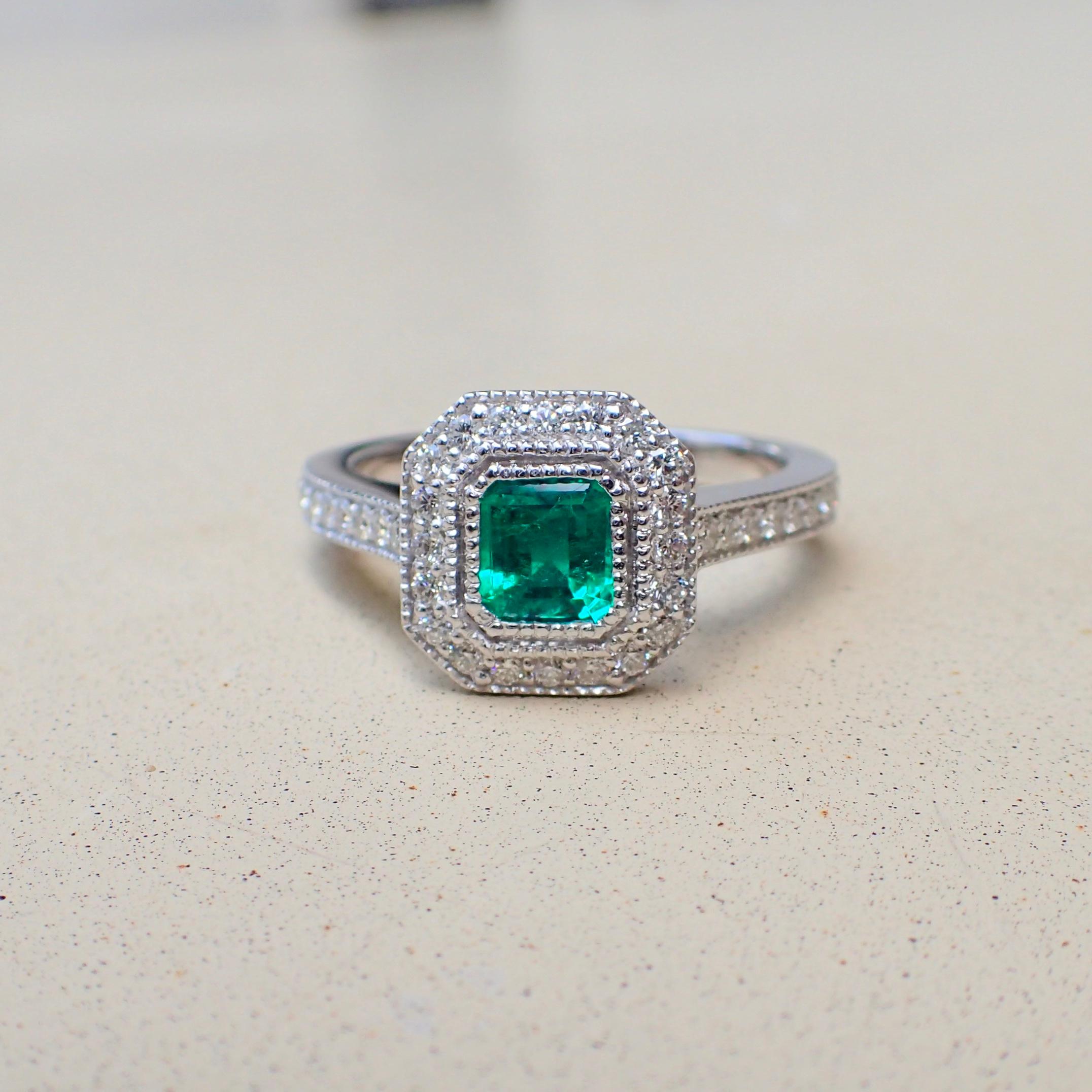 Emerald Cut 18 Karat White Gold Ring with a 0.518 Carat Emerald and 0.37 Carat of Diamond