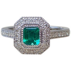 18 Karat White Gold Ring with a 0.518 Carat Emerald and 0.37 Carat of Diamond