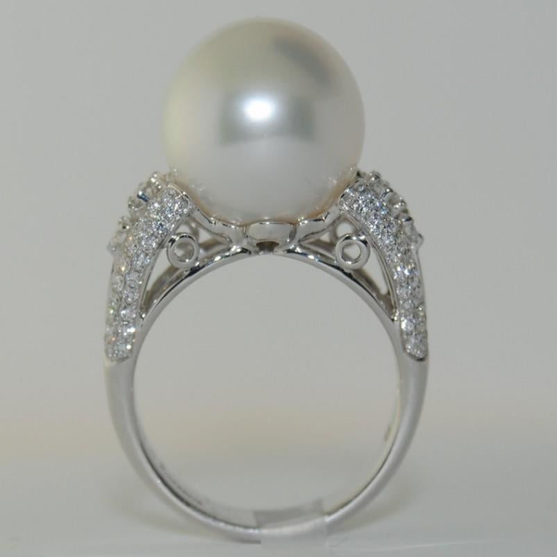 This 18-karat White Gold Ring has a  13mm Cultured South Sea Pearl with 116 Round Diamonds that weigh .66 carats.
Size is 6.00
New Ring
