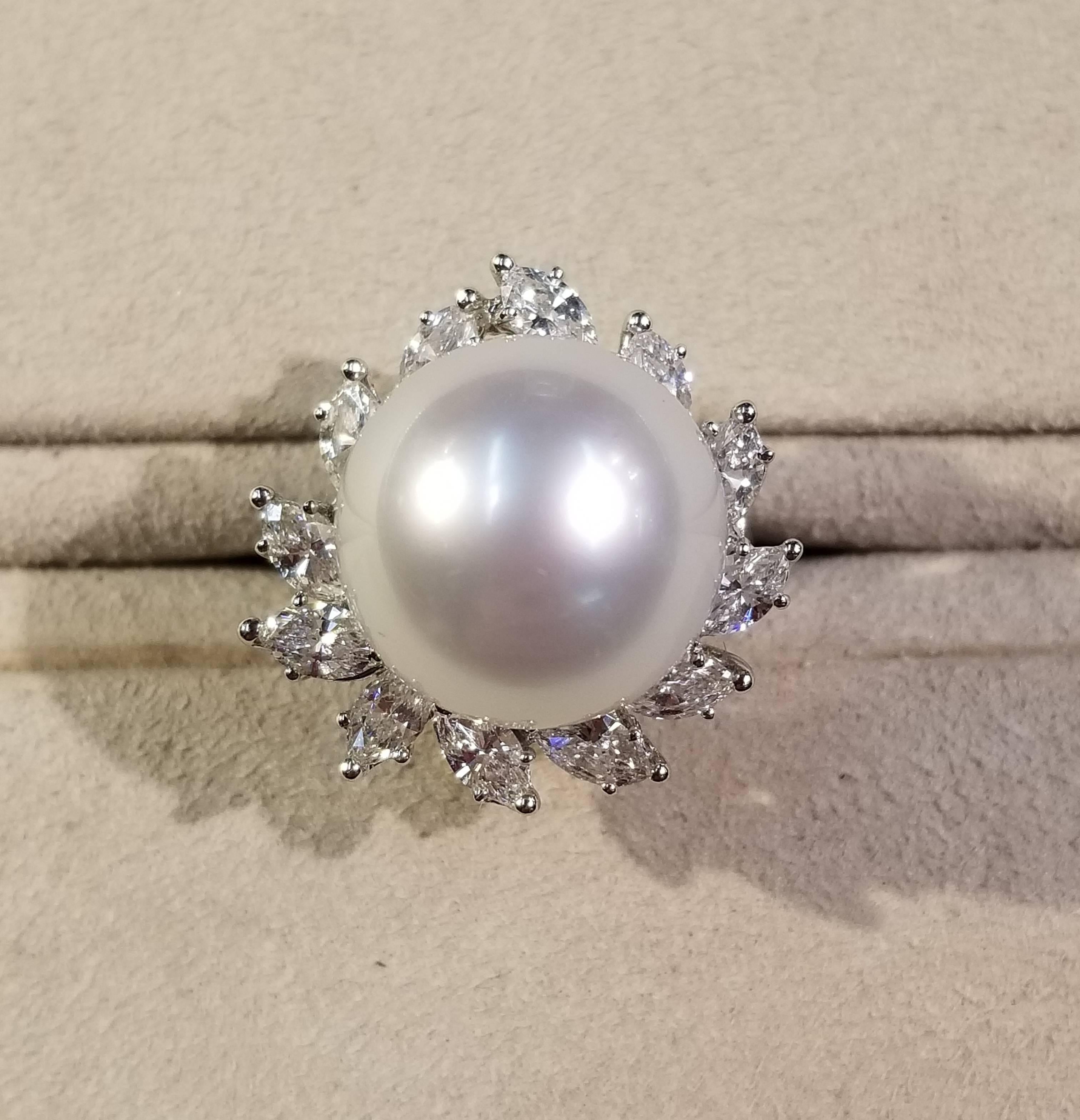 18 karat white gold ring, size 5 1/4, with a south sea pearl and surrounding marquise diamonds. The pearl has a diameter of 15 mm. The total weight of the diamonds is 1.74 carats and they are H-I color and VS-SI clarity.