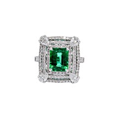 18 Karat White Gold Pear Cut White Diamonds and 2.77 ct Emerald Engagement Ring