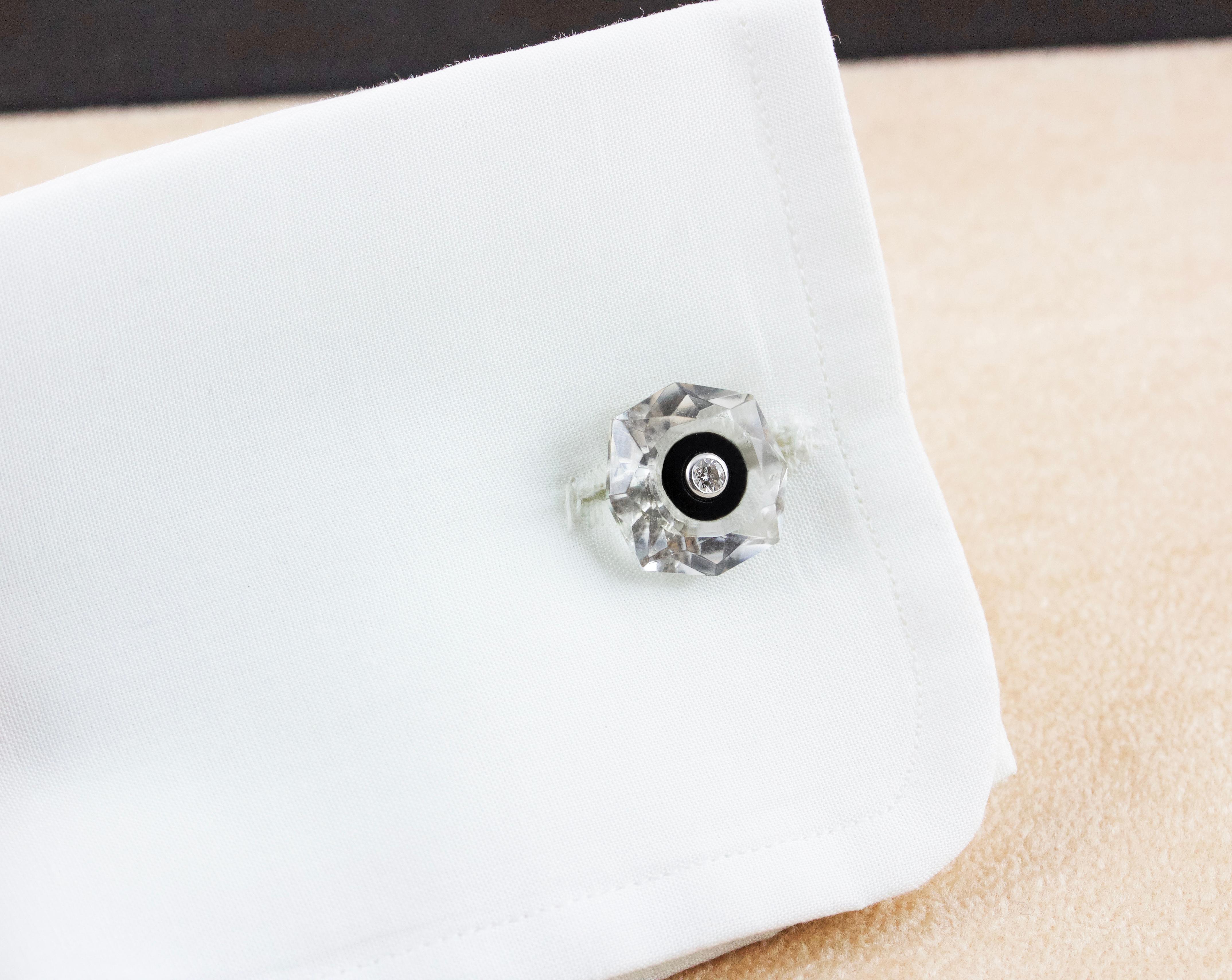These striking cufflinks are made of Rock Crystal, whose shimmering transparency highlights the texture of its front face and toggle, both shaped as a multifaceted octagon. Each element is adorned in the center with a decoration made of onyx and