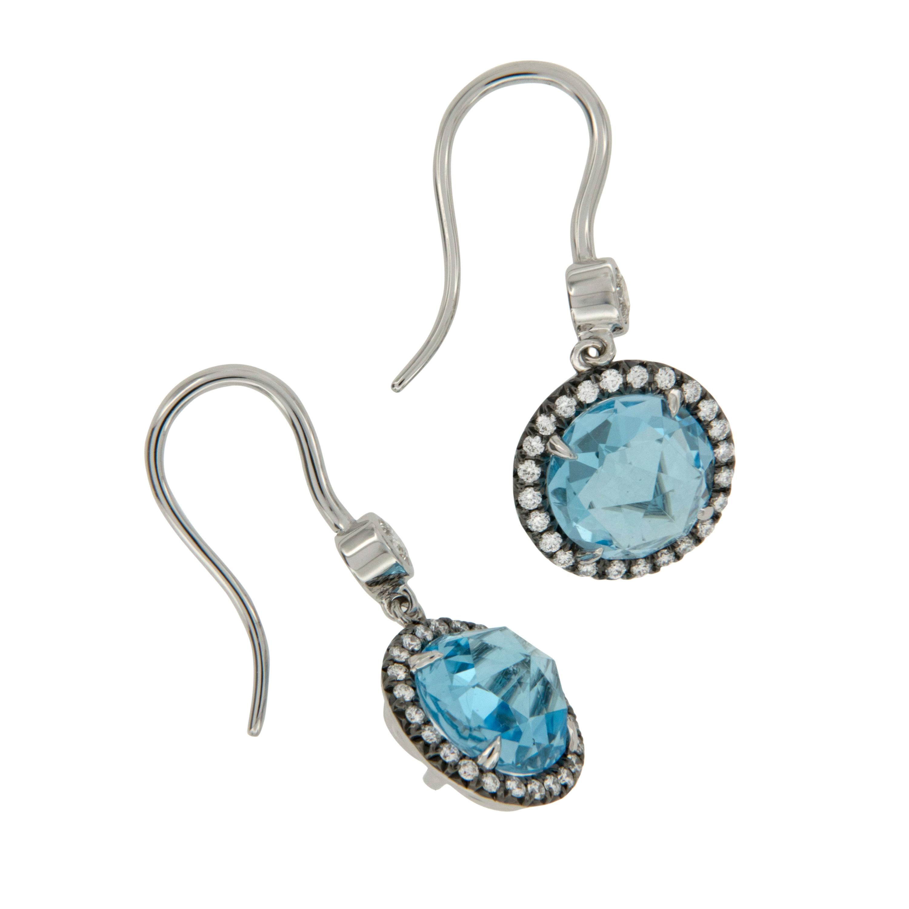 The perfect Winter Wonderland earrings, even Jack Frost would be jealous! These 4.27 Cttw. icy rose cut blue topaz are further accented by 0.41 Cttw fine white diamonds set in black rhodium dangling from bezel set diamond hooks sure to shimmer from