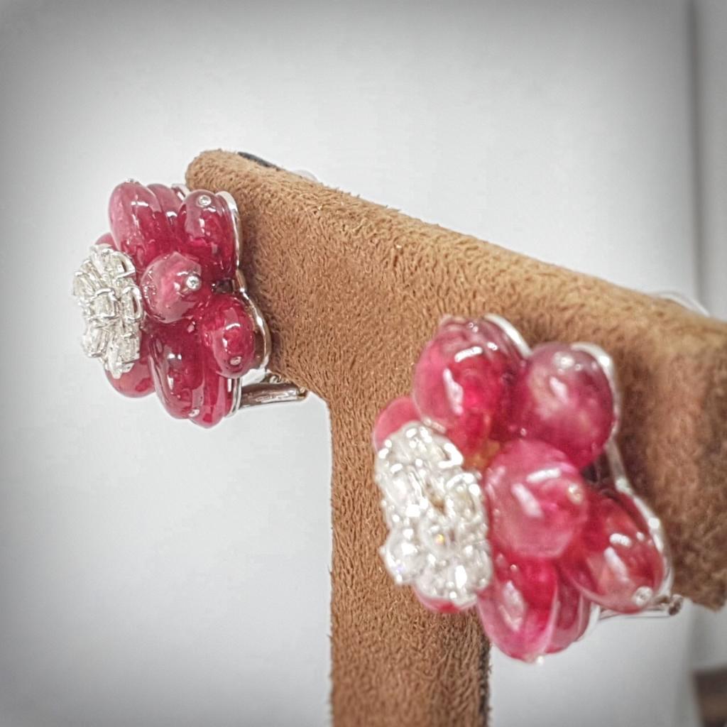 Natural tumble shape spinel beads form a layer for the diamond rose cuts to rest on. The ear studs have a minimum metal and they are crafted to perfection in 18 karat white gold. We have always loved a canvas with a splash of colours & what better