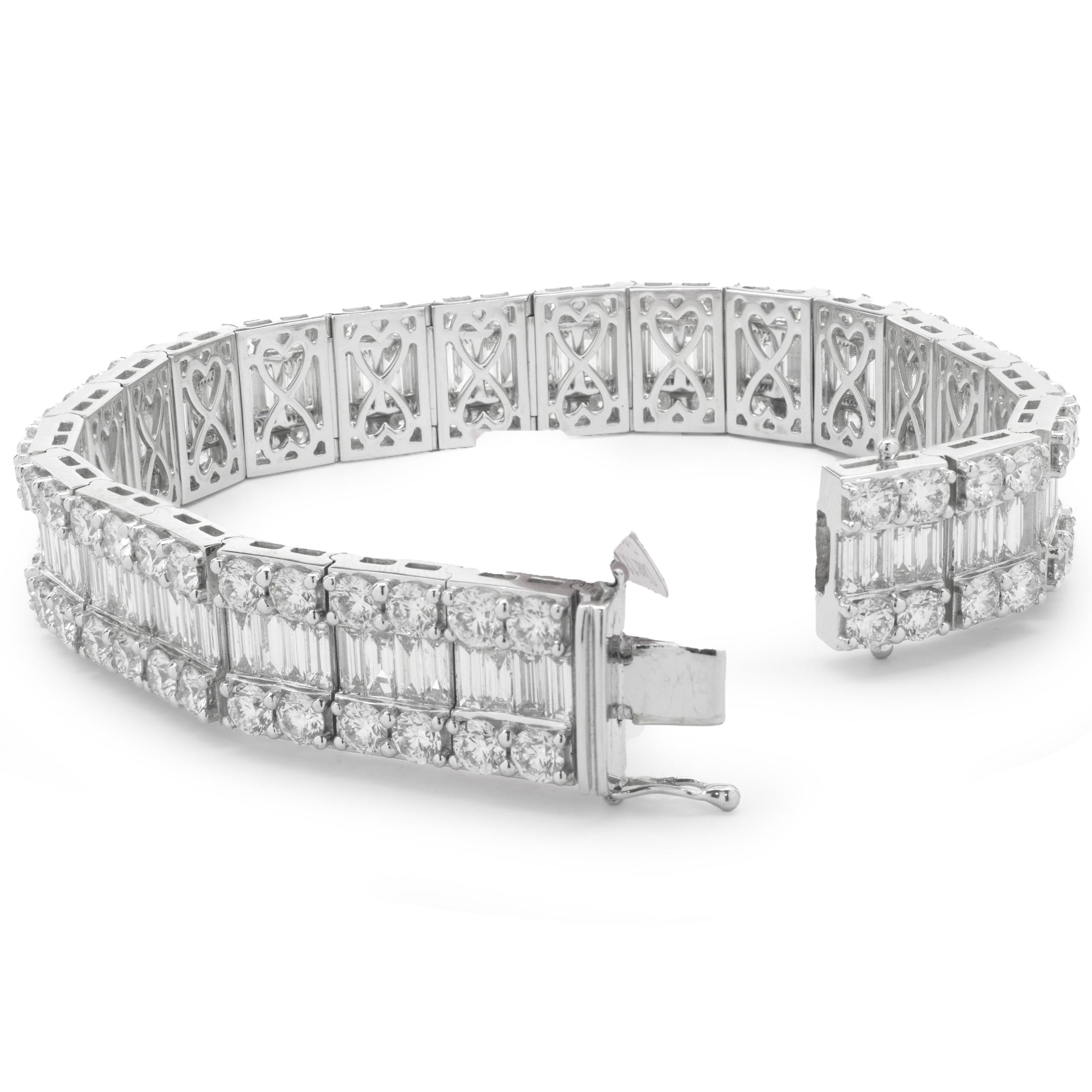 Designer: custom
Material: 18K white gold
Diamond: 184 round brilliant and baguette= 21.95cttw
Color: G
Clarity: VS
Dimensions: bracelet will fit up to a 7-inch wrist
Weight: 53.12 grams
