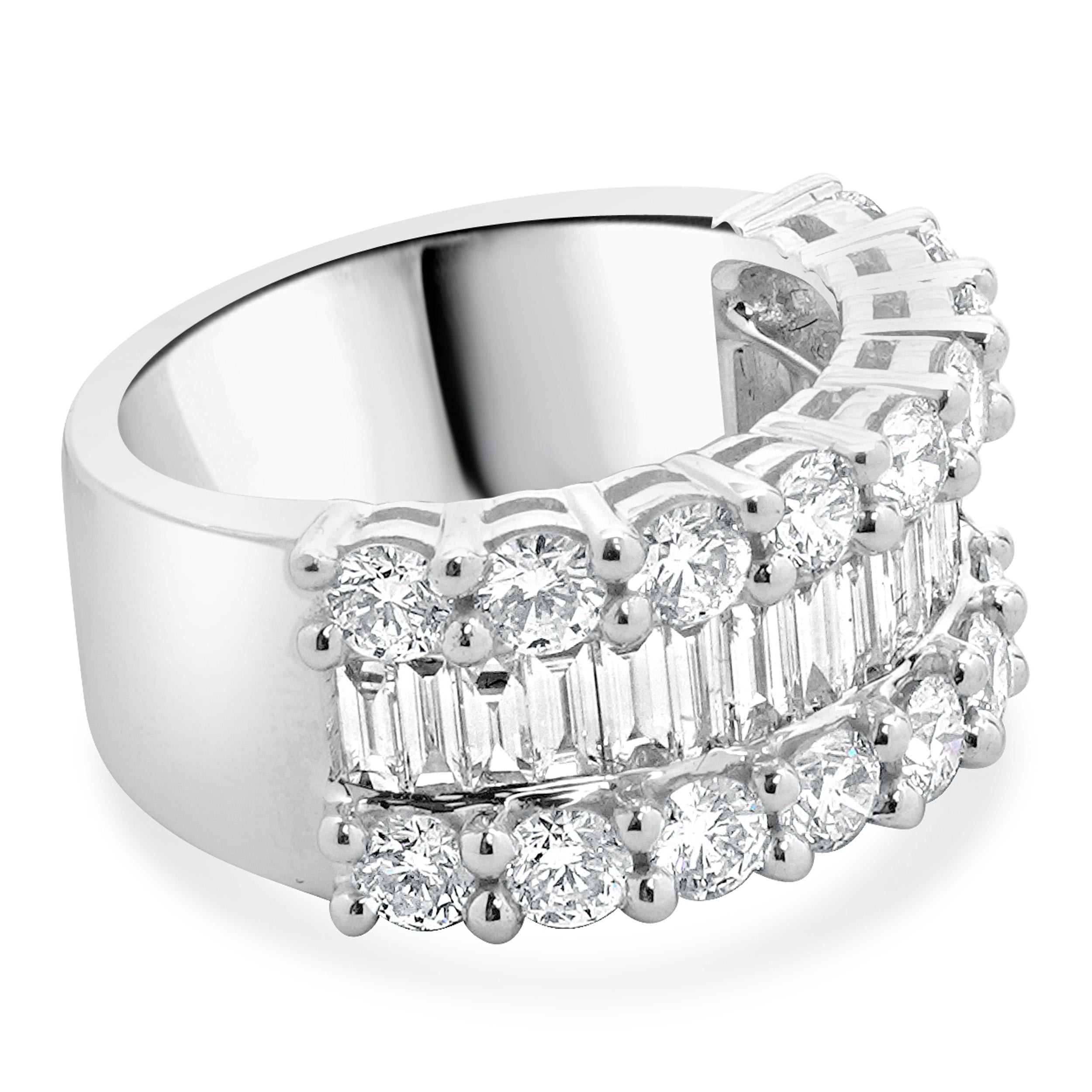 Material: 18K white gold
Diamond: 18 round brilliant cut = 2.03cttw
Color: F / G
Clarity: VS2-SI1
Diamond: 18 baguette cut = 0.95cttw
Color: G
Clarity: VS2
Ring Size: 6.5 (please allow up to 2 additional business days for sizing