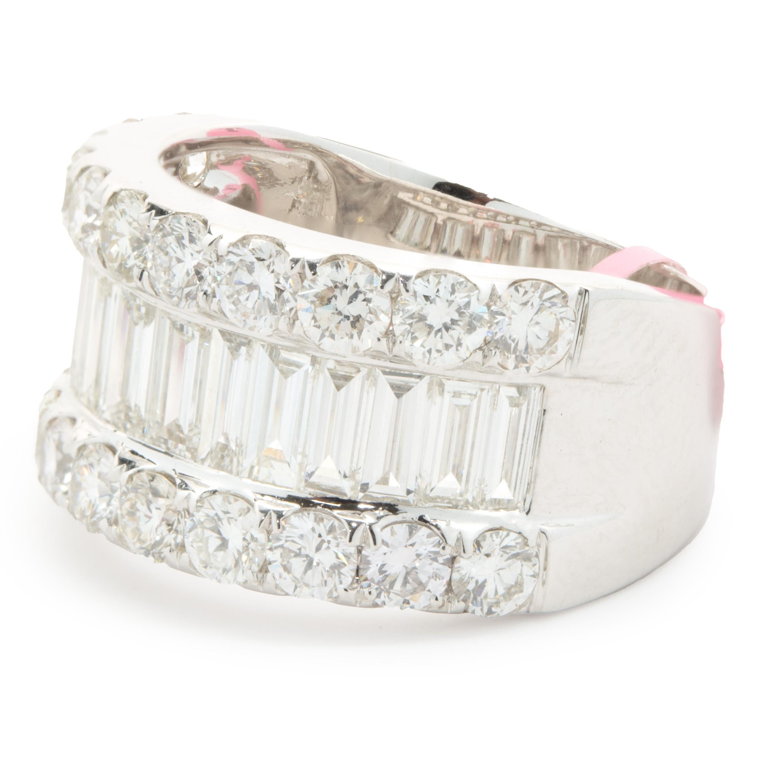Designer: custom
Material: 18K white gold
Diamond: 22 round brilliant cut = 1.80cttw
Color: G 
Clarity: VS1-2
Diamond: 15 baguette cut = 1.61cttw
Color: G 
Clarity: VS1-2
Ring size: 6.25 (please allow two additional shipping days for sizing