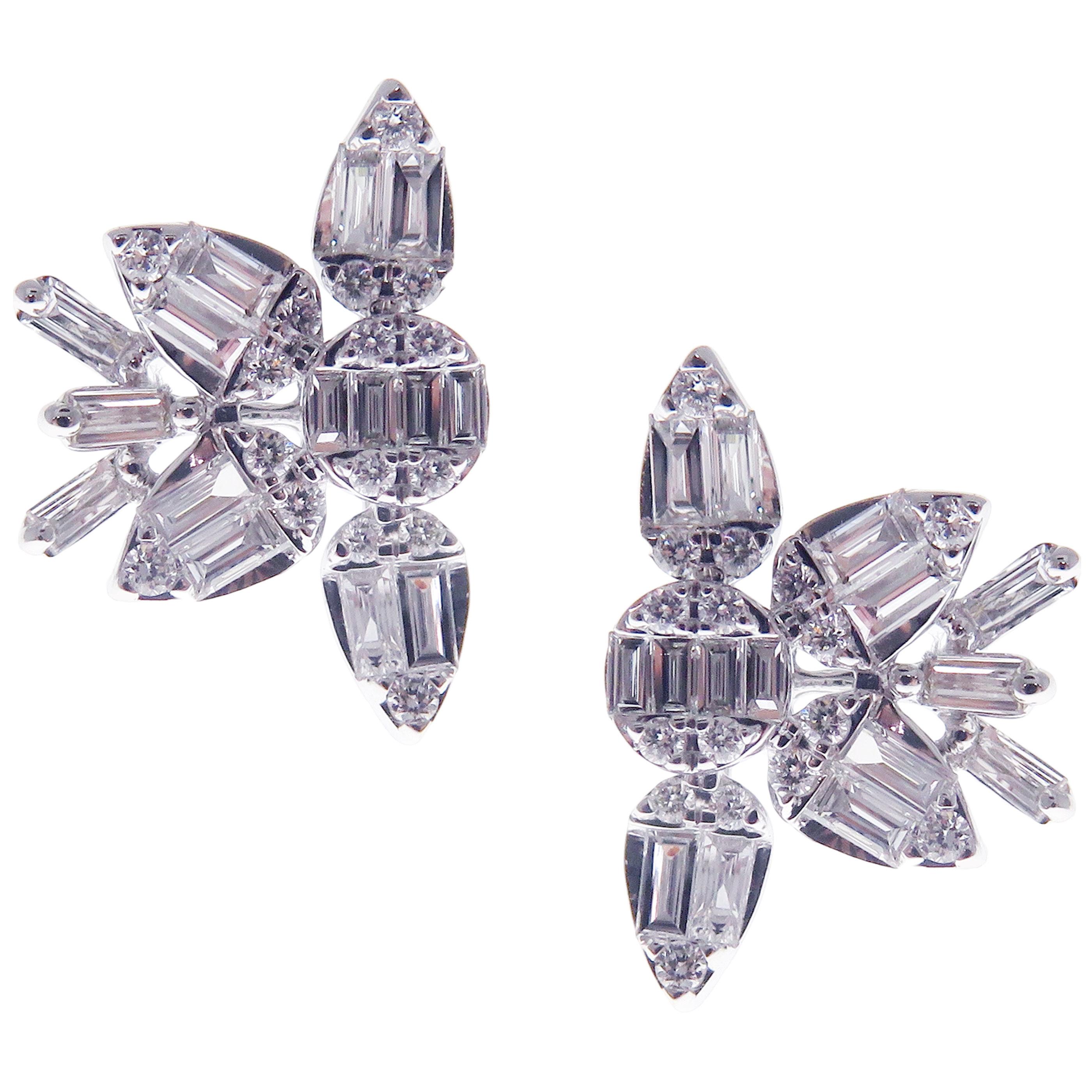 These trendy snowflake inspired stud earrings with multi shapes illusion round and baguette white diamonds are crafted in 18-karat white gold, featuring 32 round white diamonds totaling of 0.17 carats and 30 baguette white diamonds totaling of 0.57