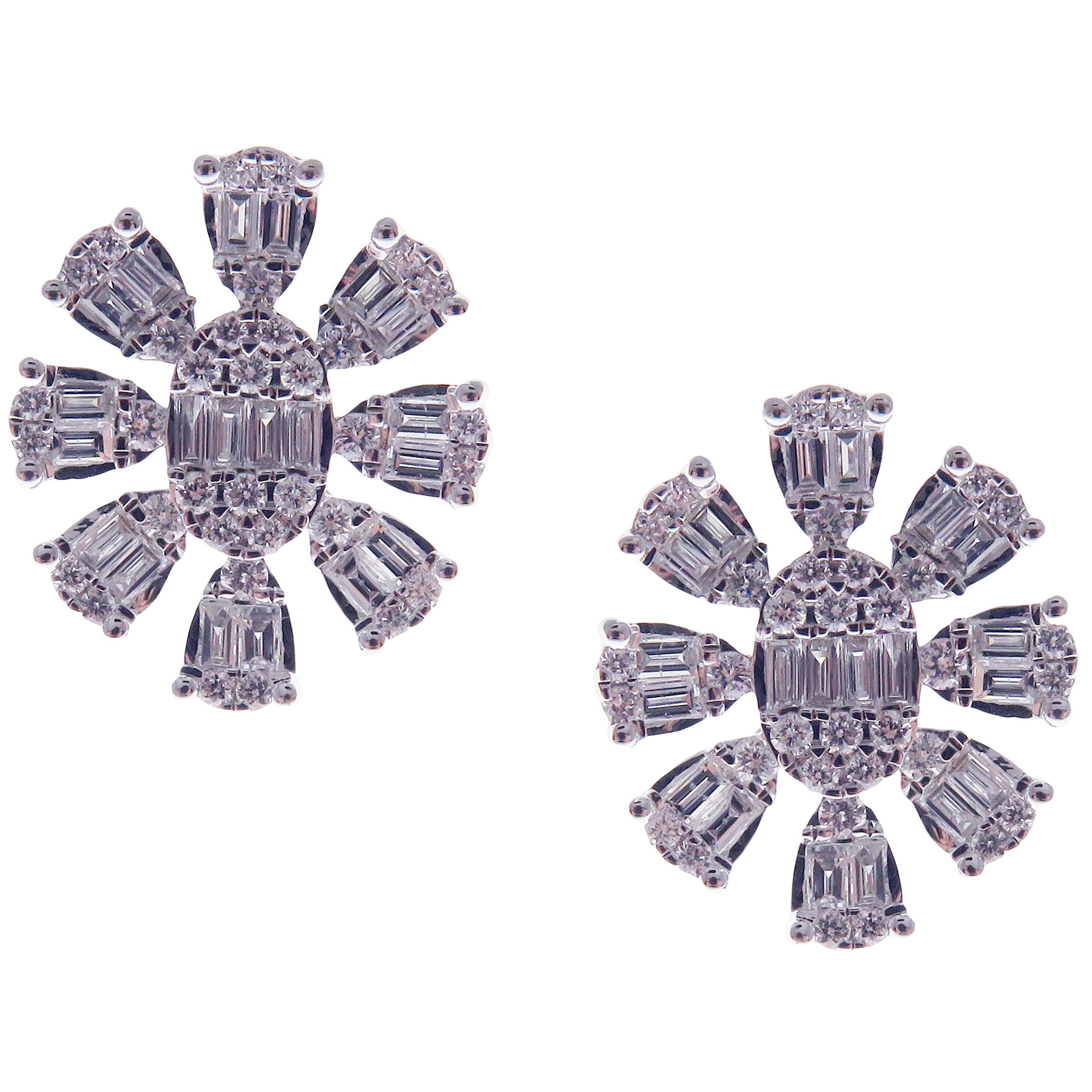 These trendy snowflake inspired stud earrings with round and baguette white diamonds are crafted in 18-karat white gold, featuring 68 round white diamonds totaling of 0.50 carats and 40 baguette white diamonds totaling of 0.64 carats.
These earrings