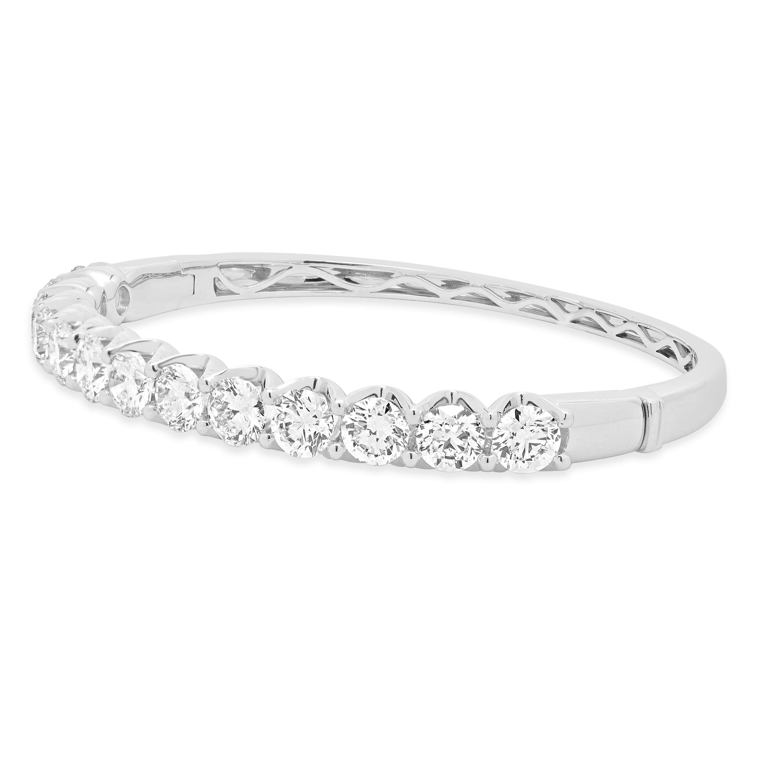 Designer : design personnalisé
MATERIAL : Or blanc 18K
Diamant : 11 diamants ronds de taille brillant = 9,25cttw
Couleur : H / I
Clarté : VS2-SI1
Dimensions : le bracelet convient à un poignet de 7 pouces maximum.
Poids : 24,85 grammes