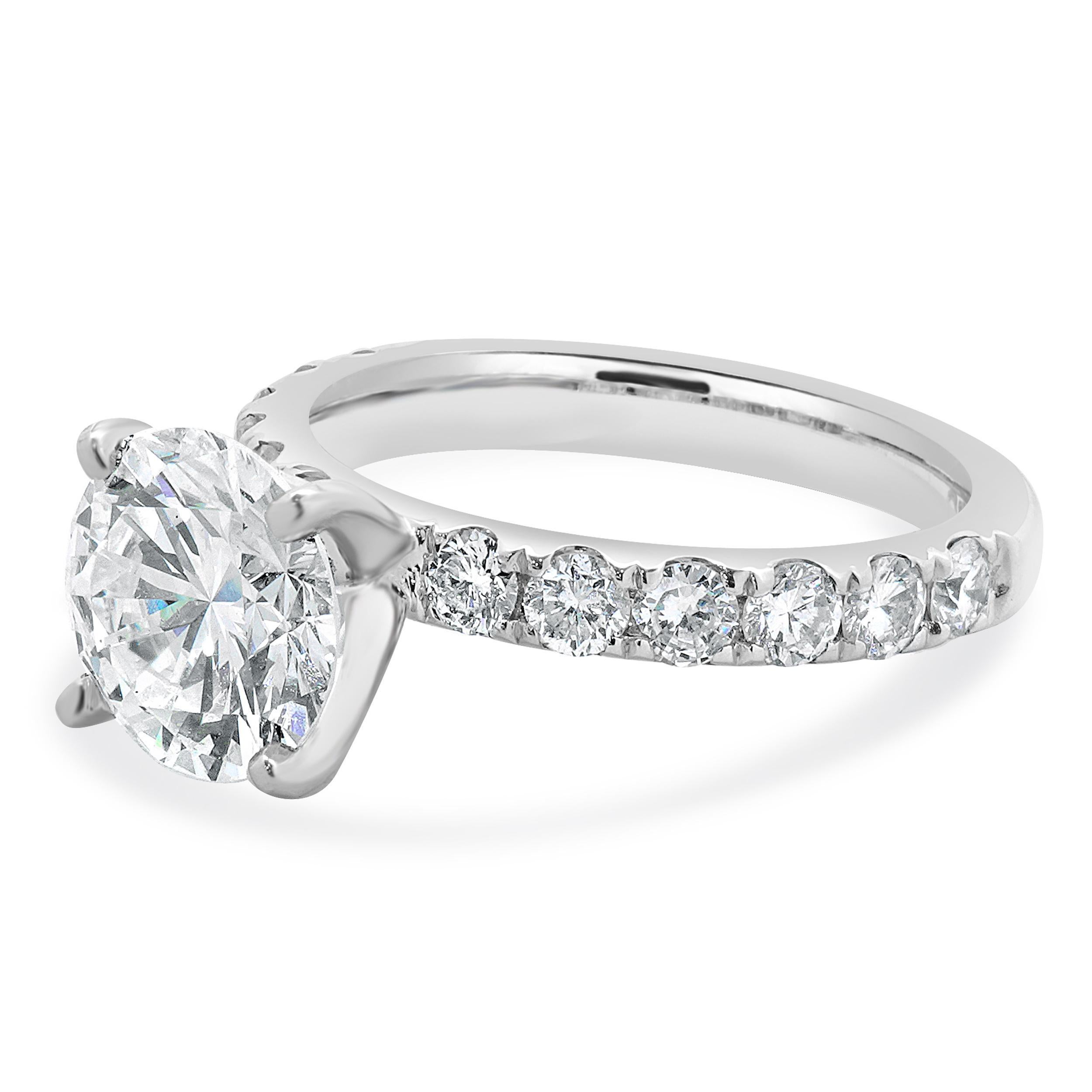 Designer: custom
Material: 18K white gold
Center Diamond: 1 round brilliant cut = 2.49ct
Color : H
Clarity : SI1
GIA: 1236289425
Diamond: round brilliant cut = 0.96cttw
Color : G
Clarity : SI1
Size: 6 complimentary sizing available 
Weight: 5.63