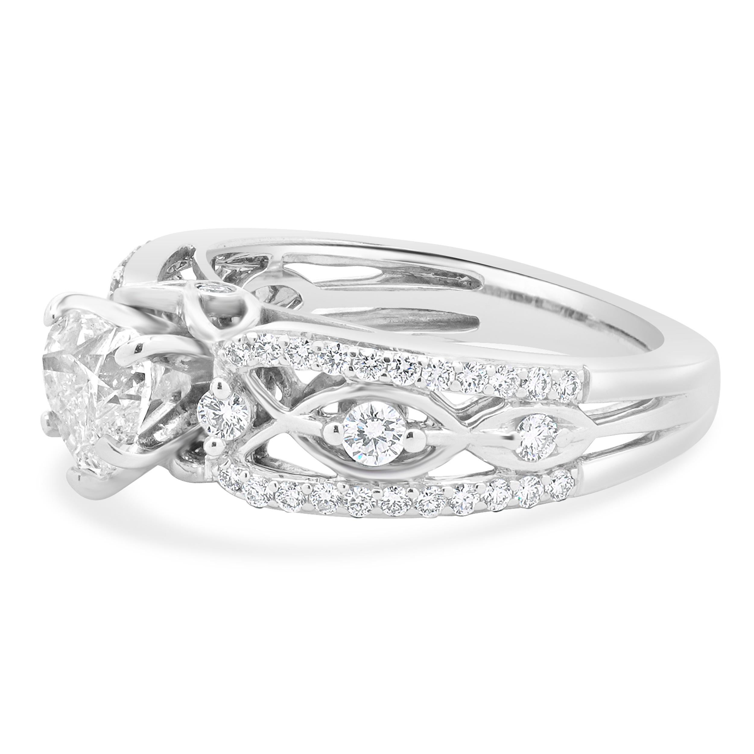 Designer: custom
Material: 18K white gold
Diamond: round brilliant cut = 0.55ct
Color: J
Clarity: SI2
Diamond: 52 round brilliant cut = 0.49cttw
Color: G
Clarity: SI1-2
Ring size: 6.75 (please allow two additional shipping days for sizing