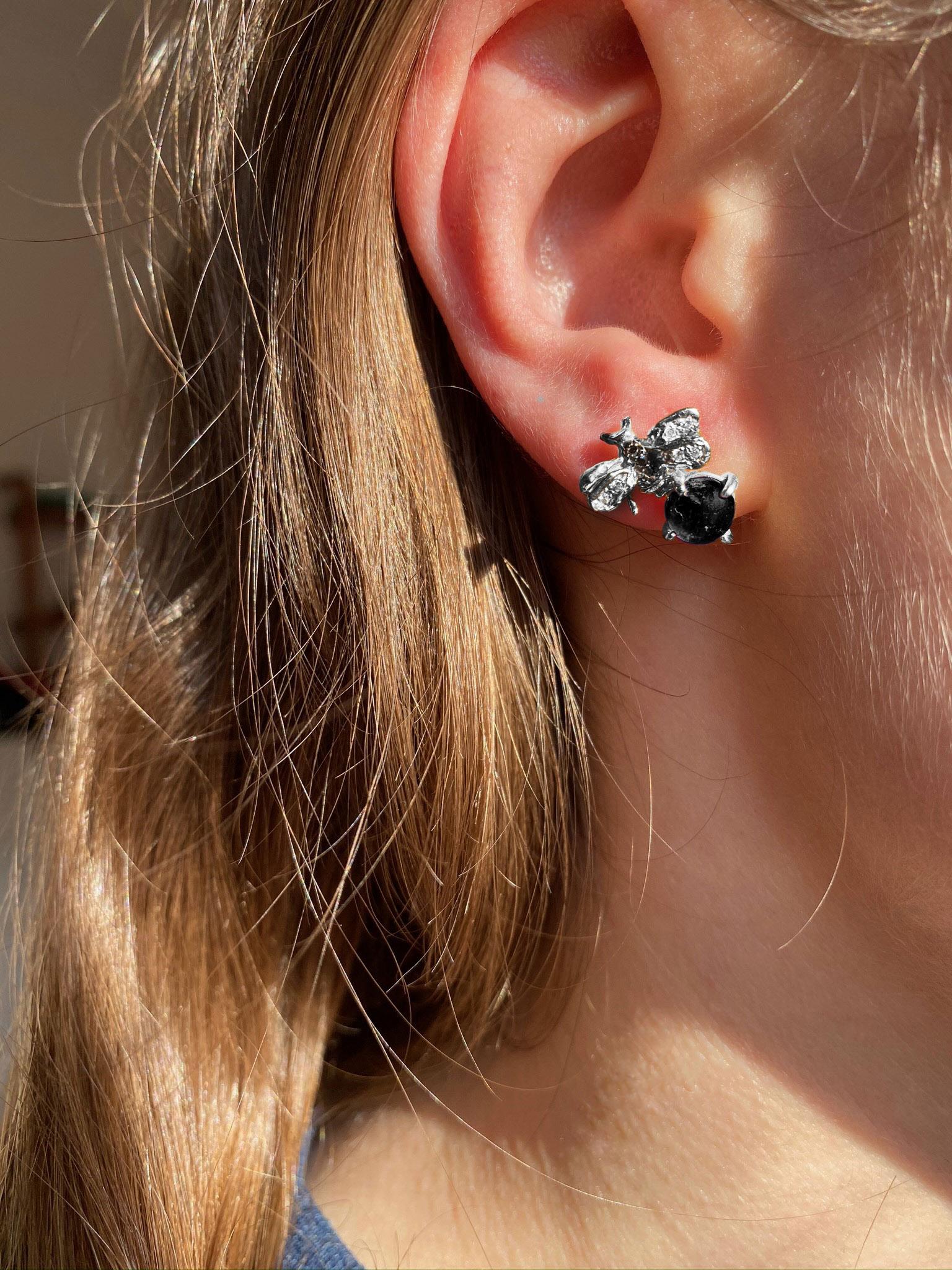 Rossella Ugolini Unisex 18Karat White Gold Round Cut Onyx 0.10 Karat White Diamonds 0.06 Karat Black Diamonds Small Bee Stud Earrings.
The bee has always inspired the designer from different points of view: from her ability to actively participate