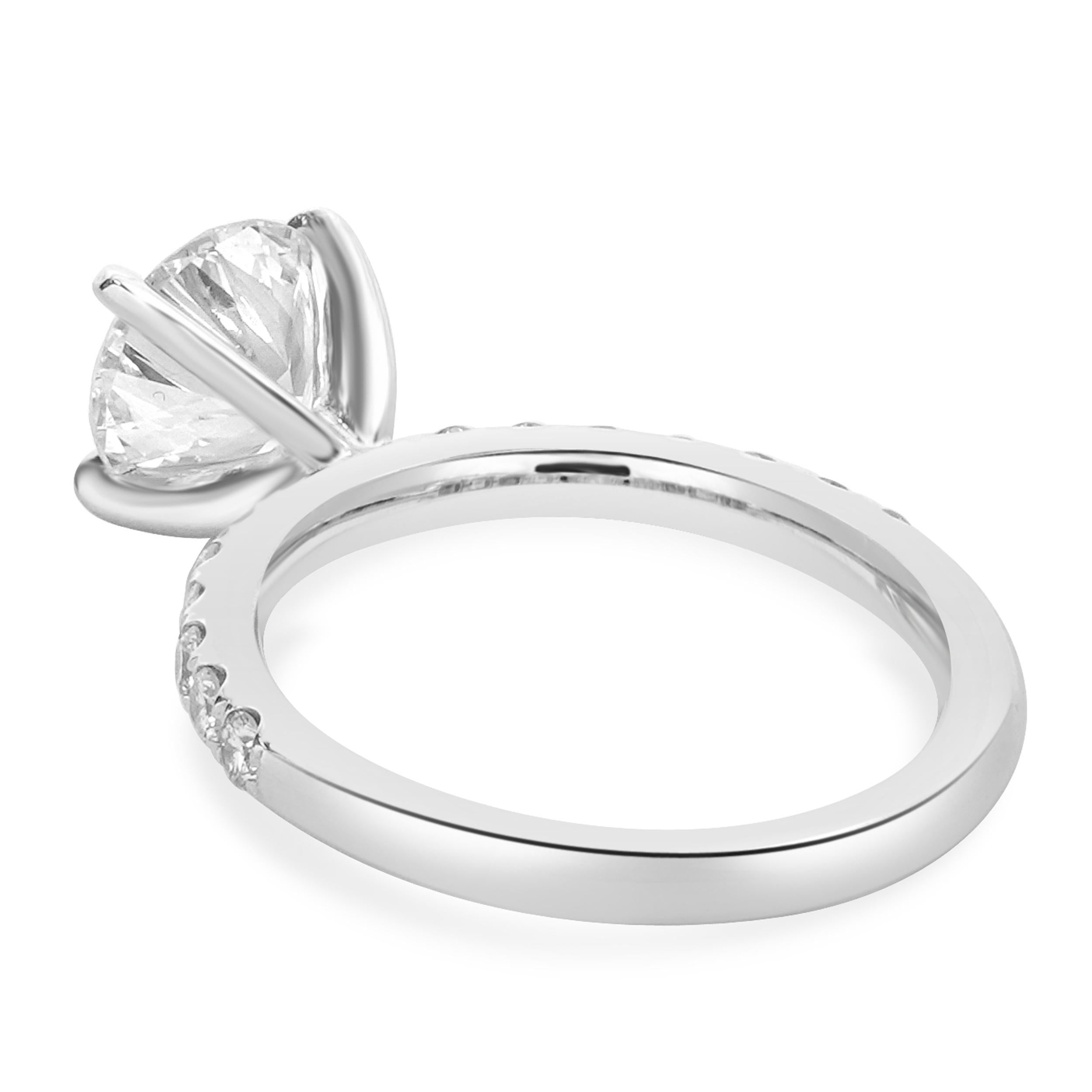 Designer: custom
Material: 18K white gold
Center Diamond: 1.82ct round 
Color: J
Clarity: SI3
Diamonds: 14 round cut= 0.42cttw
Color: G
Clarity: VS
Ring Size: 6.75 (please allow two additional shipping days for sizing requests)
Dimensions: ring top