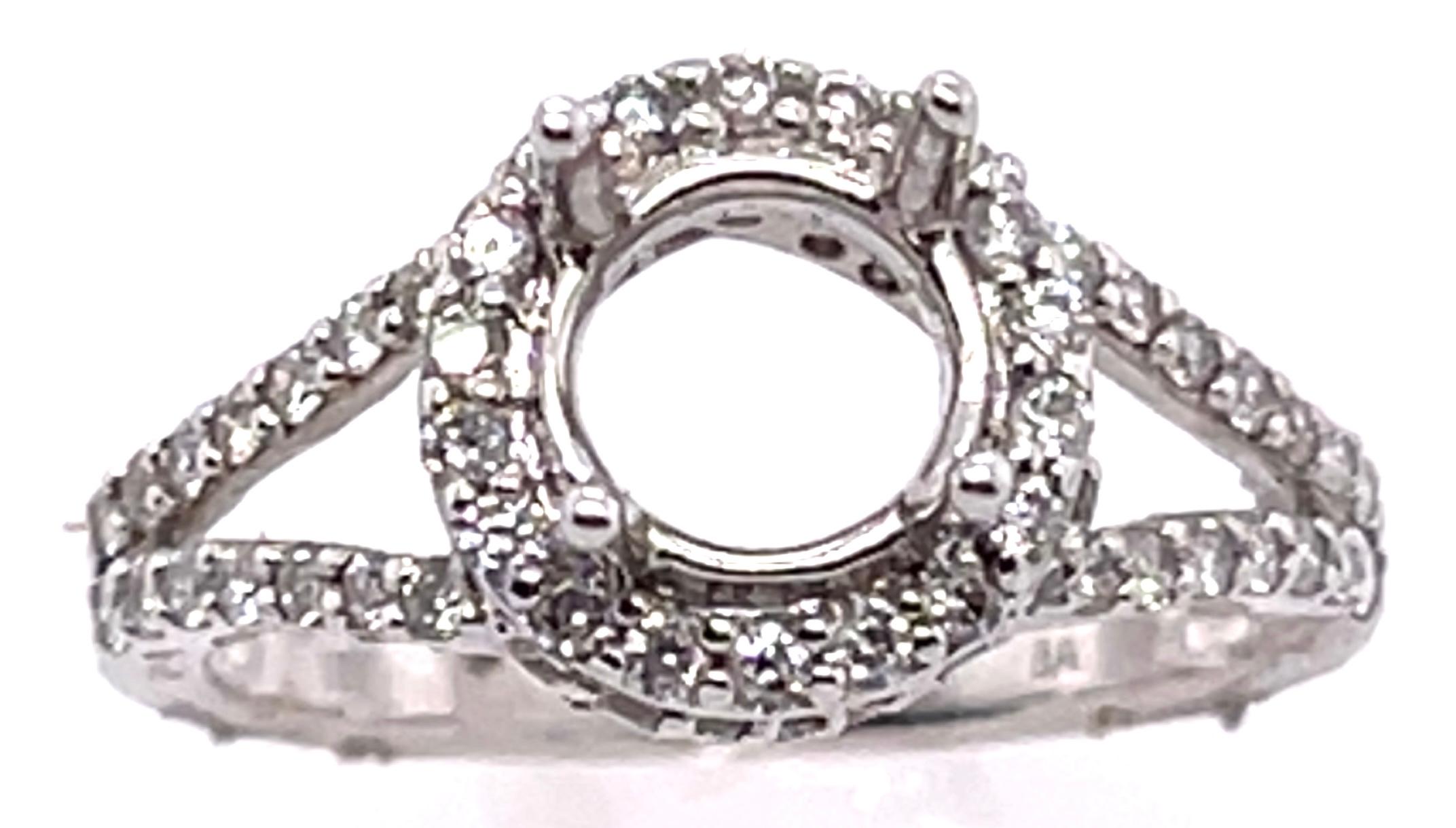 18 Karat White Gold Round Engagement Ring Setting Diamond Halo And Two Row Band
Size 6.5
0.80 total diamond weight.
4.42 grams total weight.
