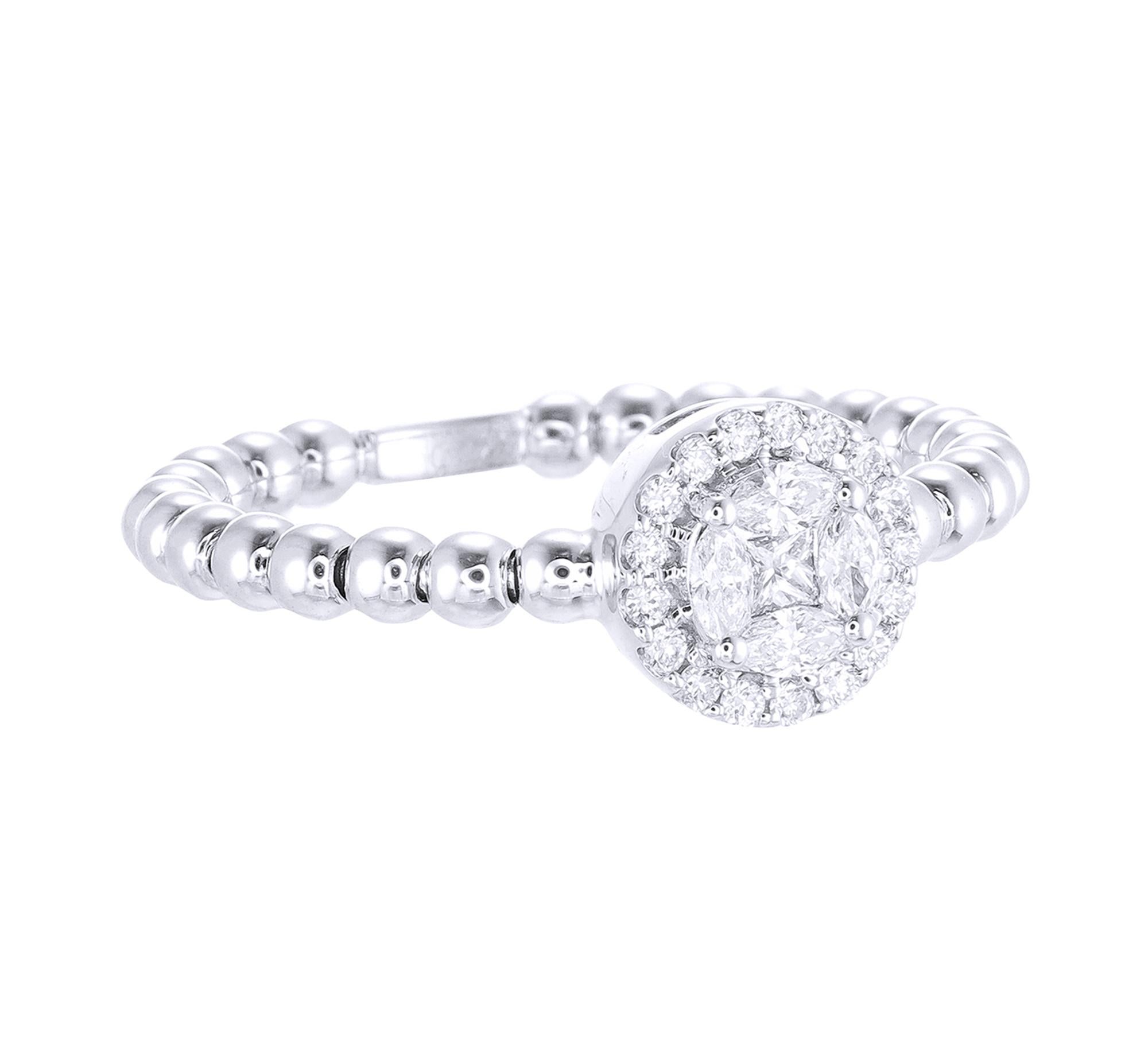 This 18K White Gold cocktail ring features a luscious Round shape White Diamond Illusion, accentuated by a halo of Round Brilliant Cut diamonds. Combine with glamorous outfits for a show-stopping effect. Each diamond hand-selected by our experts for